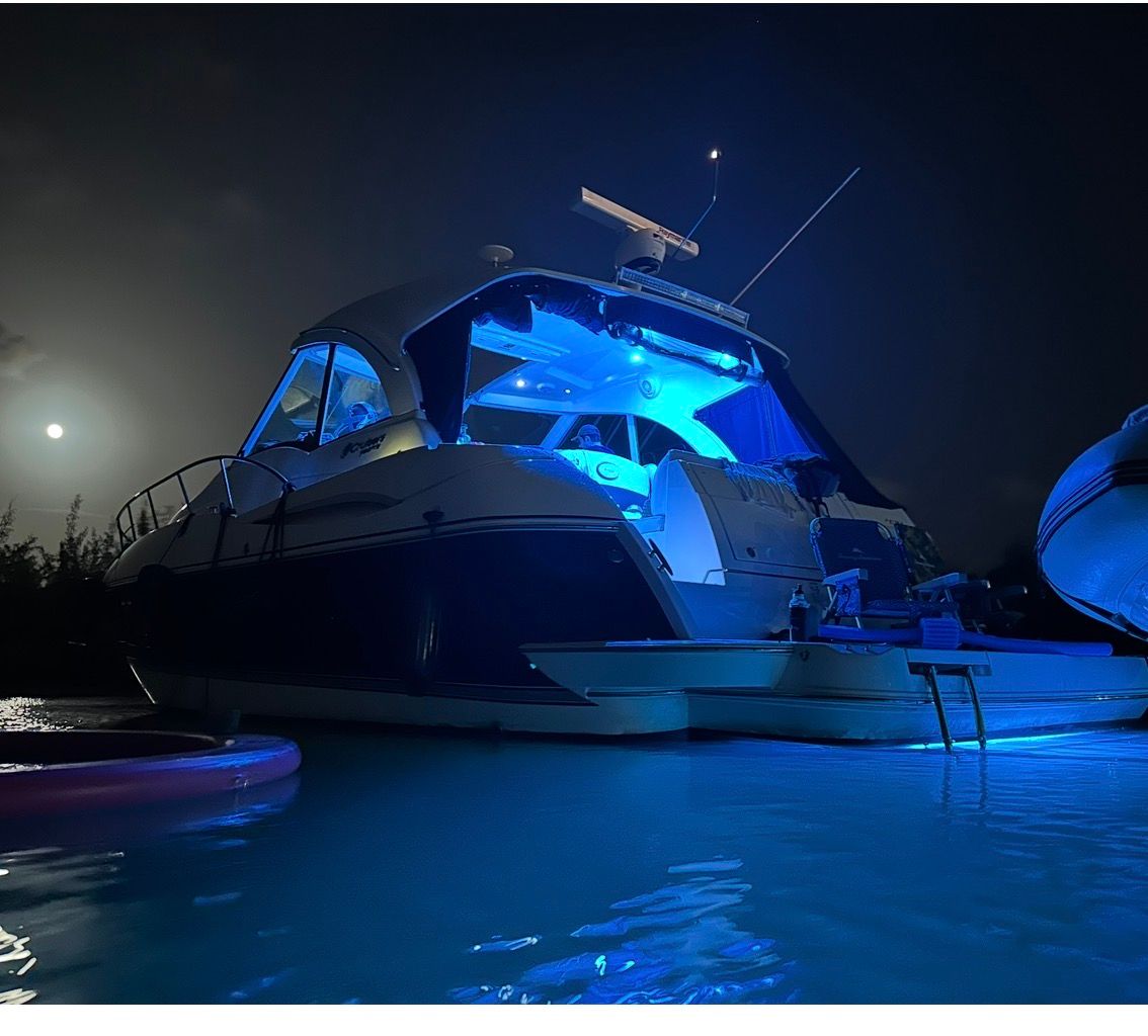 2012 Cruisers Yachts 430 Sports Coupe at night with blue lighting.