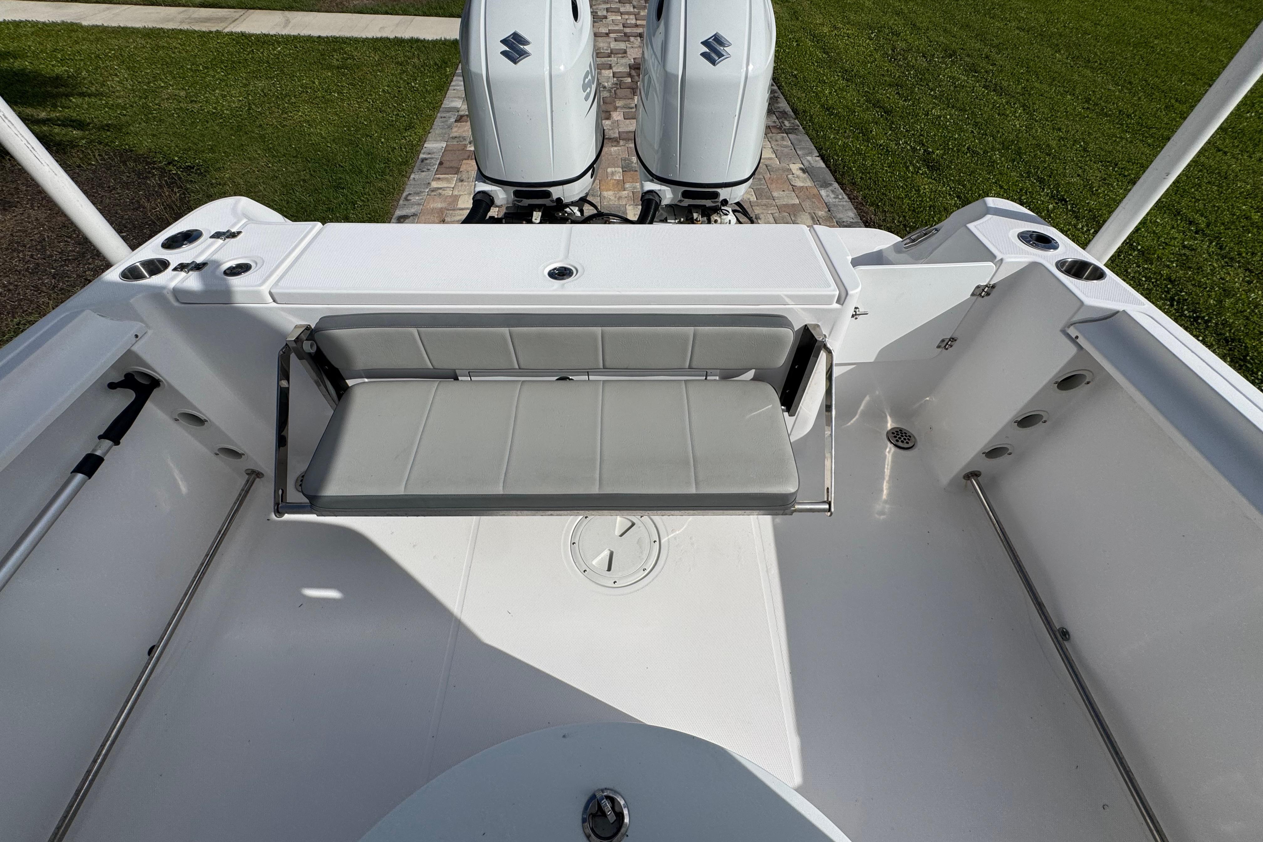 2022 Aquasport 2500 Center Console boat with dual engines and foldable seating.