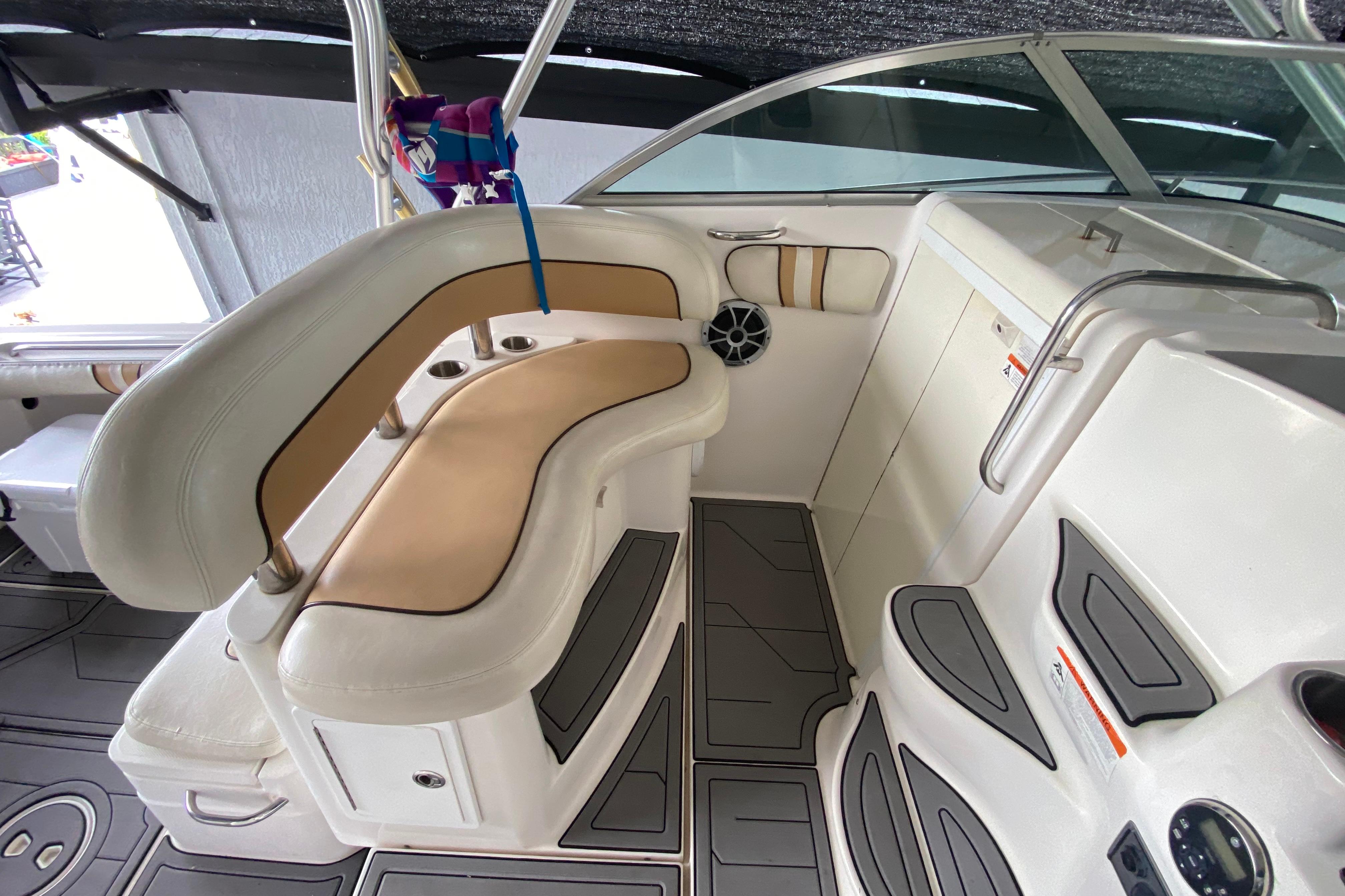 Interior of a 2005 Wellcraft 290 Coastal boat, featuring cushioned seating and modern design.