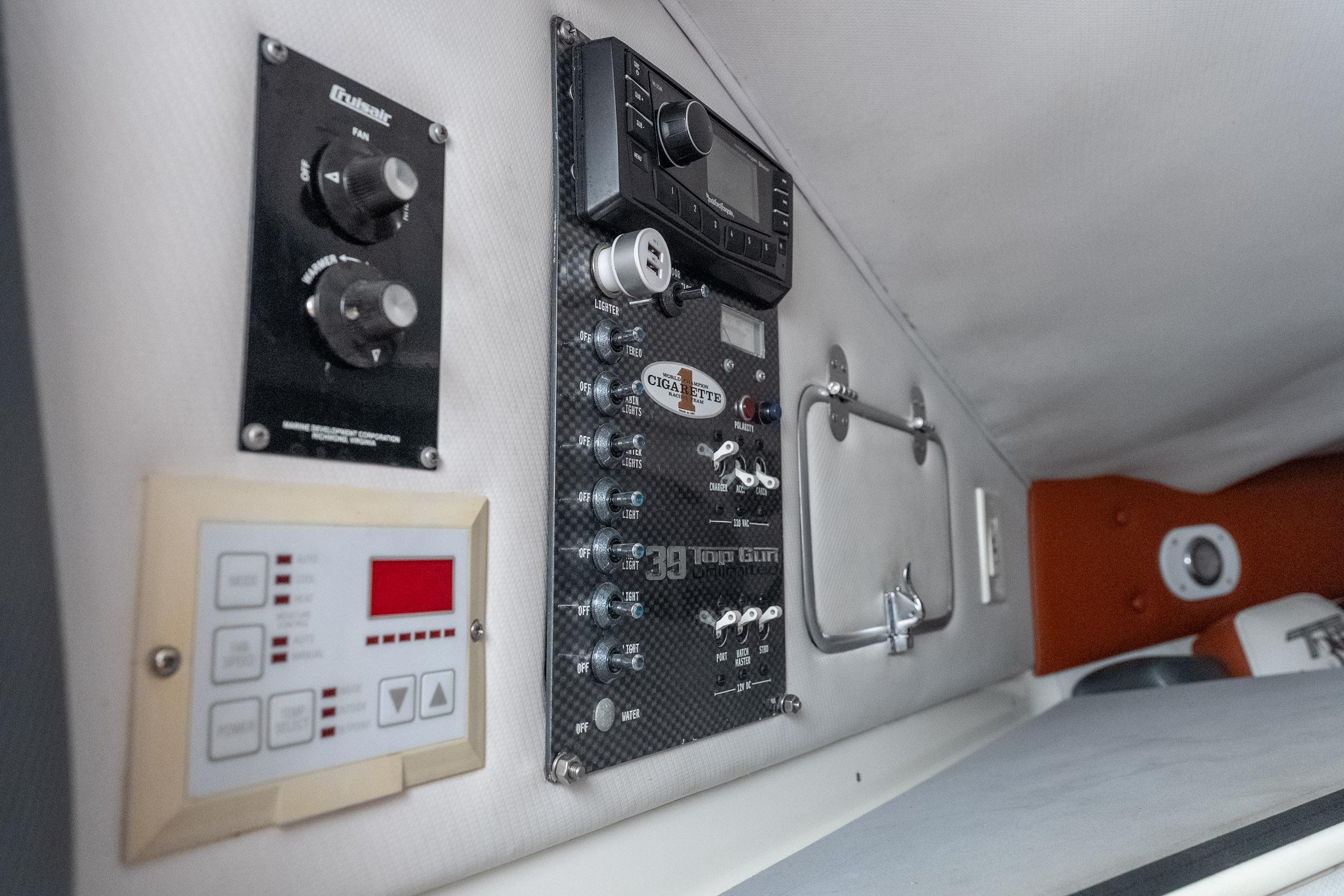 Control panel of a 2006 Cigarette 39' Top Gun Unlimited boat interior.