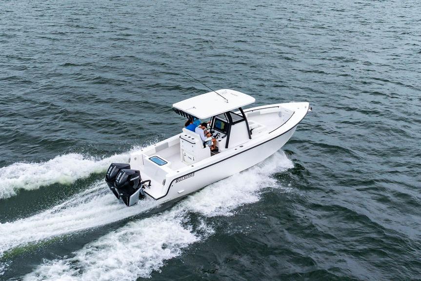 2027 Reef Runner 280 boat cruising on open water, showcasing sleek design and powerful engines.