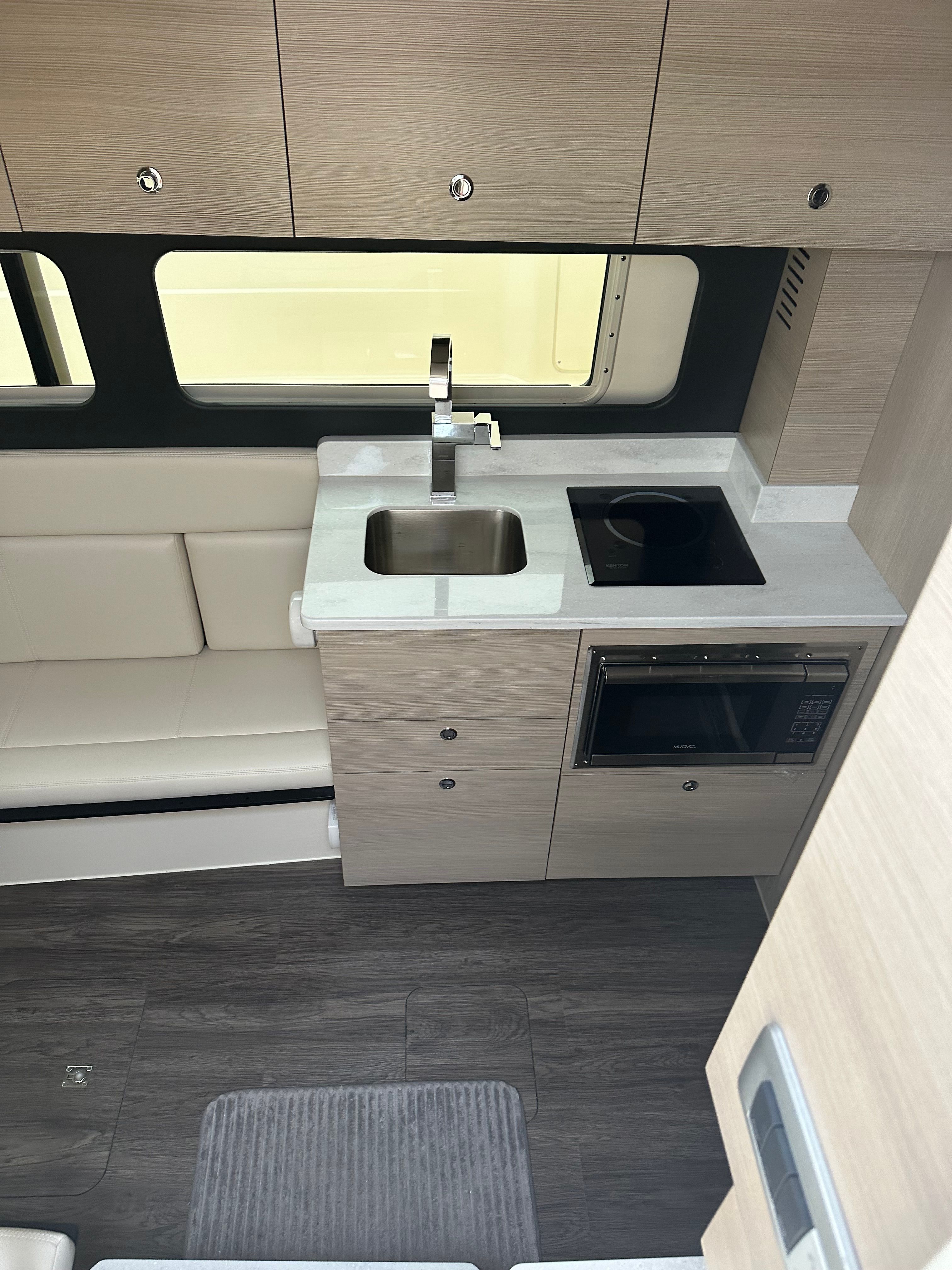Modern kitchen in a 2022 Scout 425 LXF yacht.