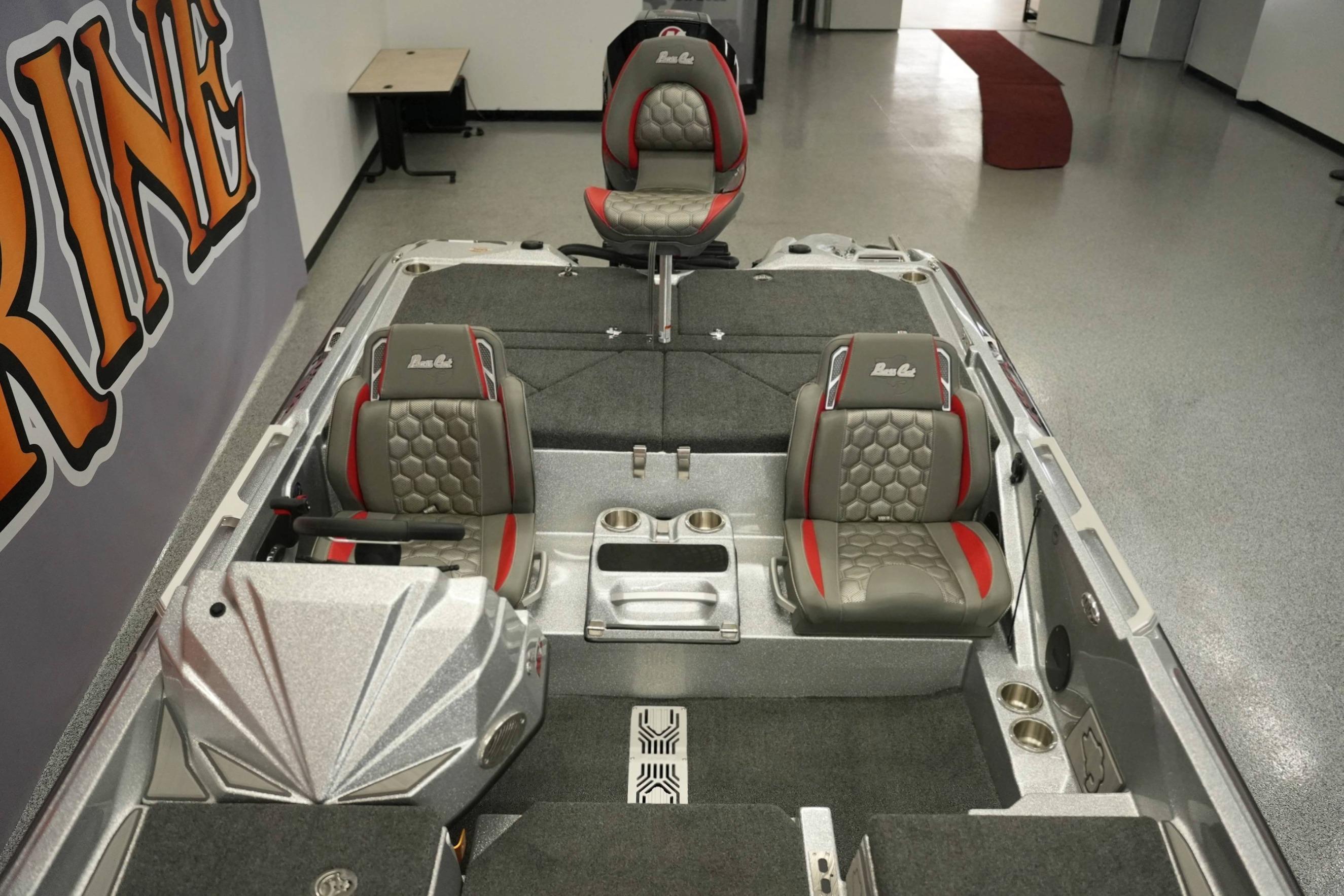 2026 Bass Cat Lynx STS boat interior with gray and red seating, modern design.
