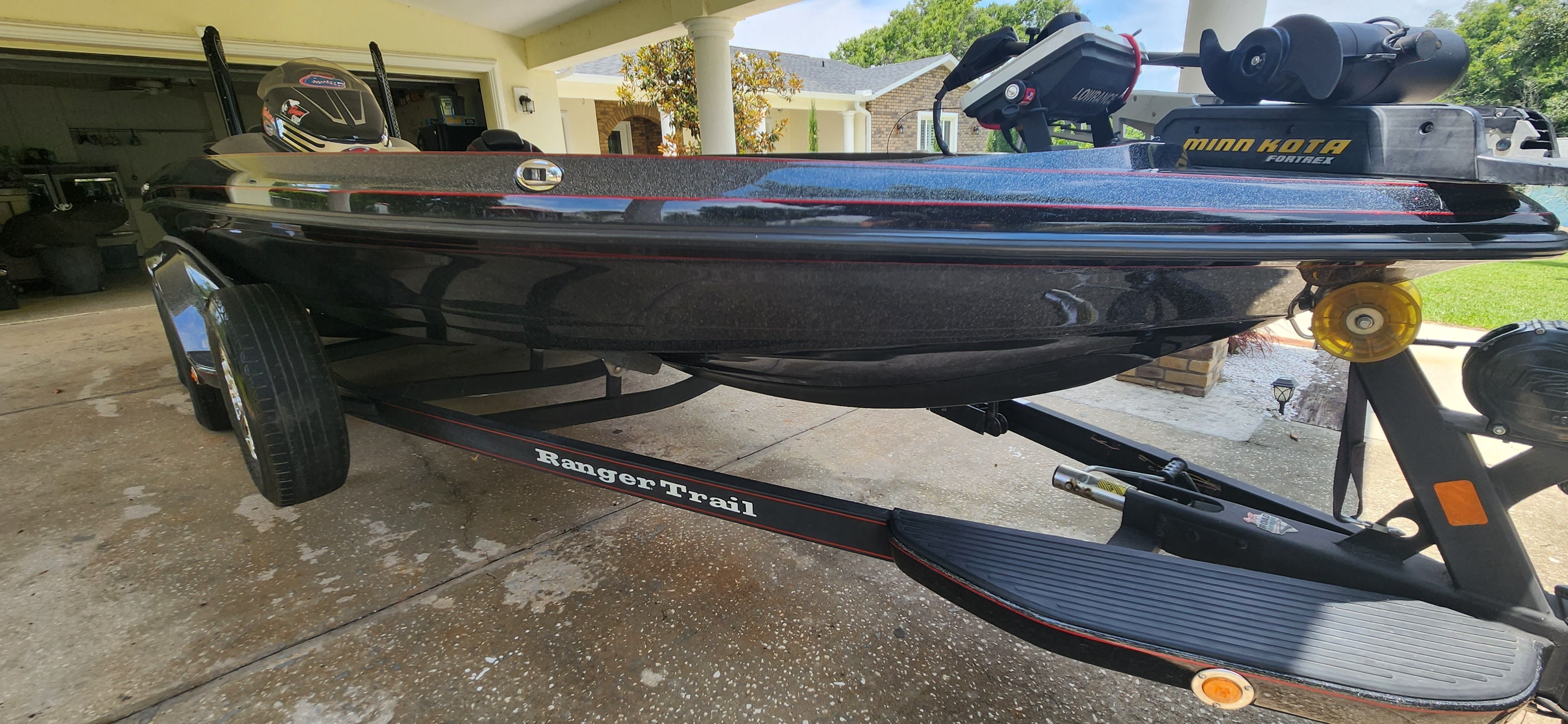 A 2017 Ranger Z520 Comanche on a trailer in a driveway.