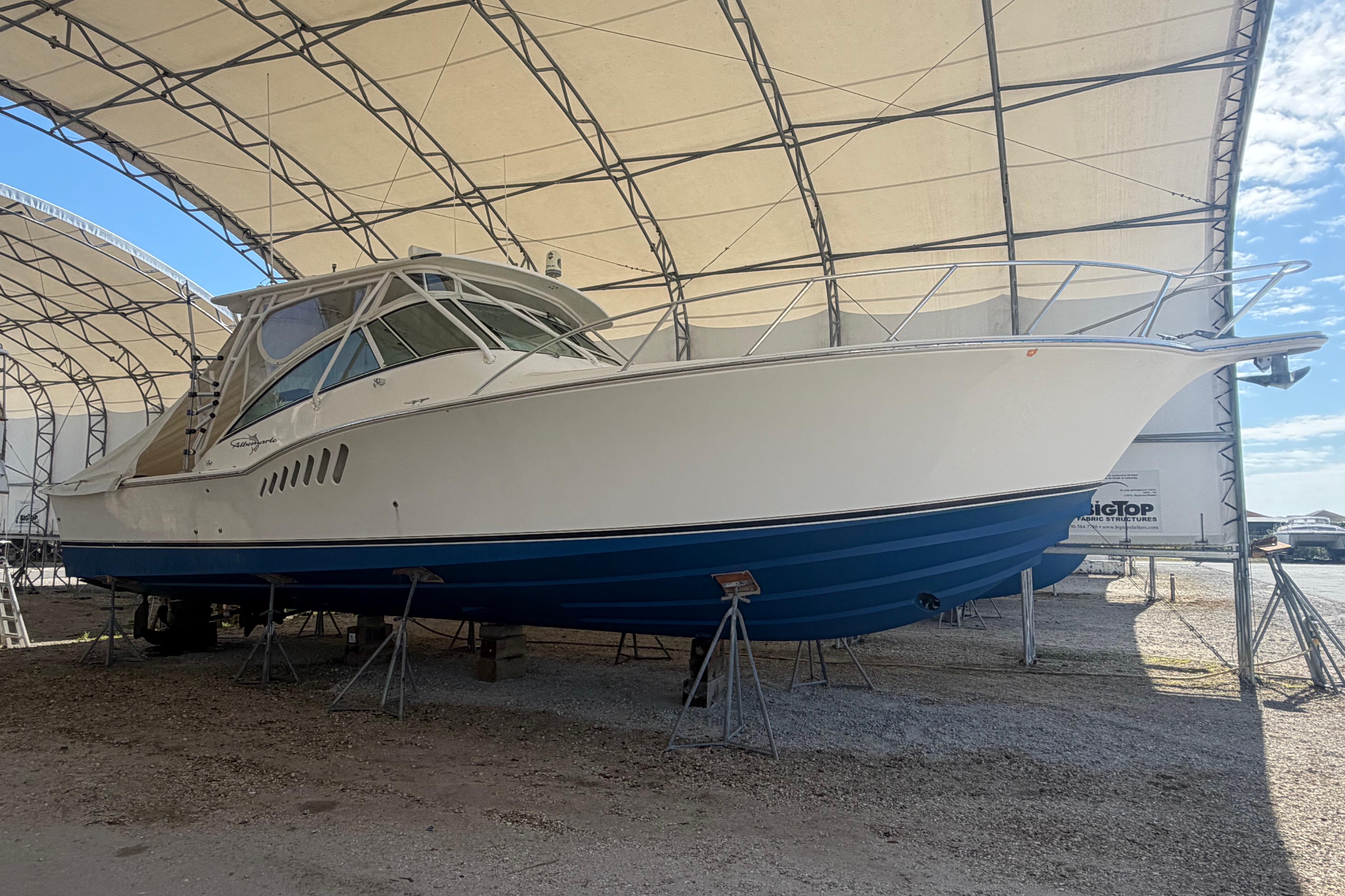 2007 Albemarle 41 Express boat in dry dock under a large canopy.