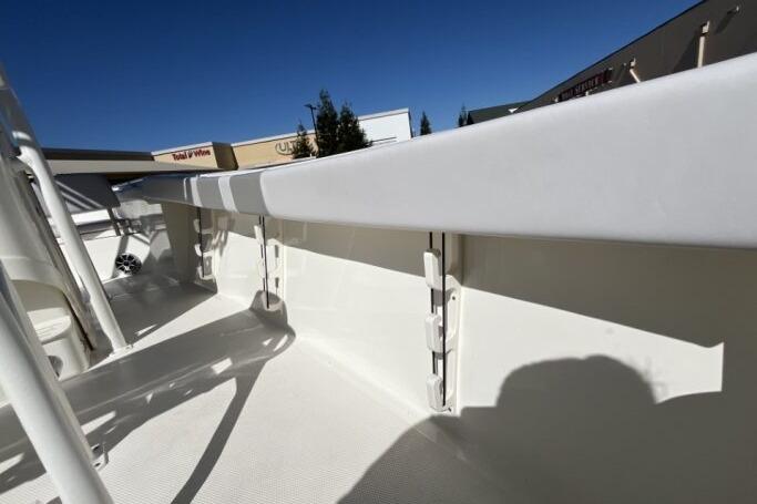 2025 Mako 214 Center Console boat interior detail under clear blue sky.