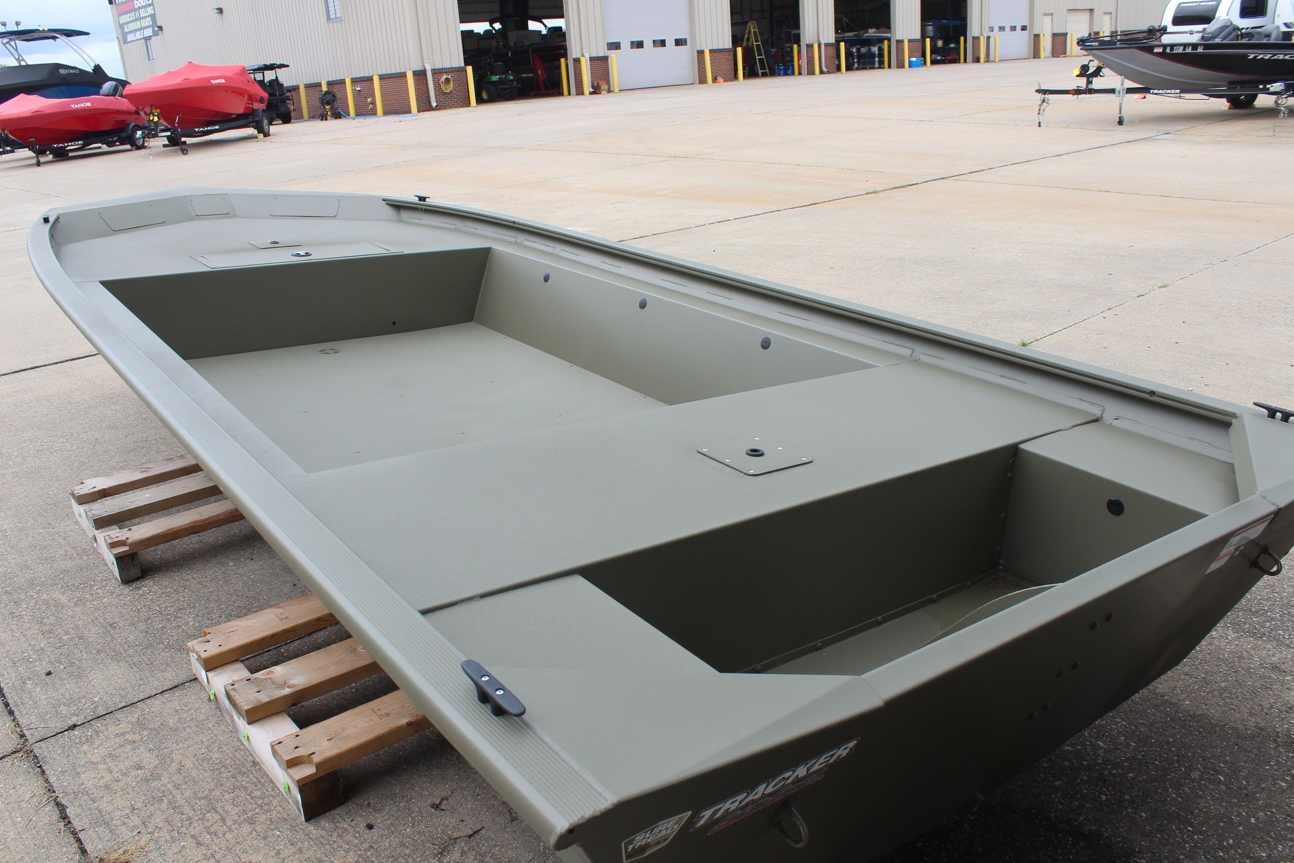 2026 Tracker Grizzly 1754 Utility boat on display at a dealership.