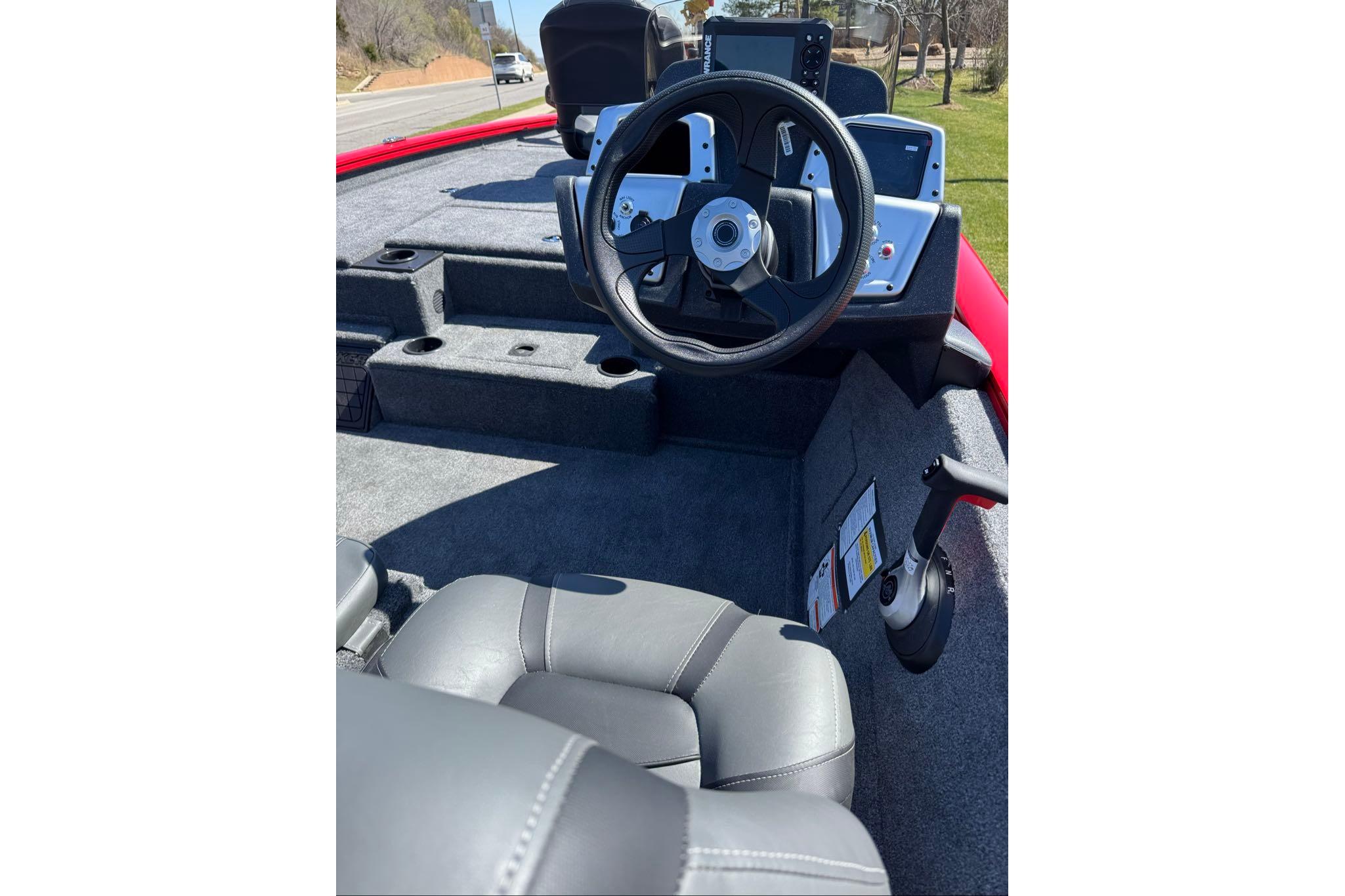 Interior view of 2026 Tracker Pro Team 195 boat, featuring steering wheel and seating.