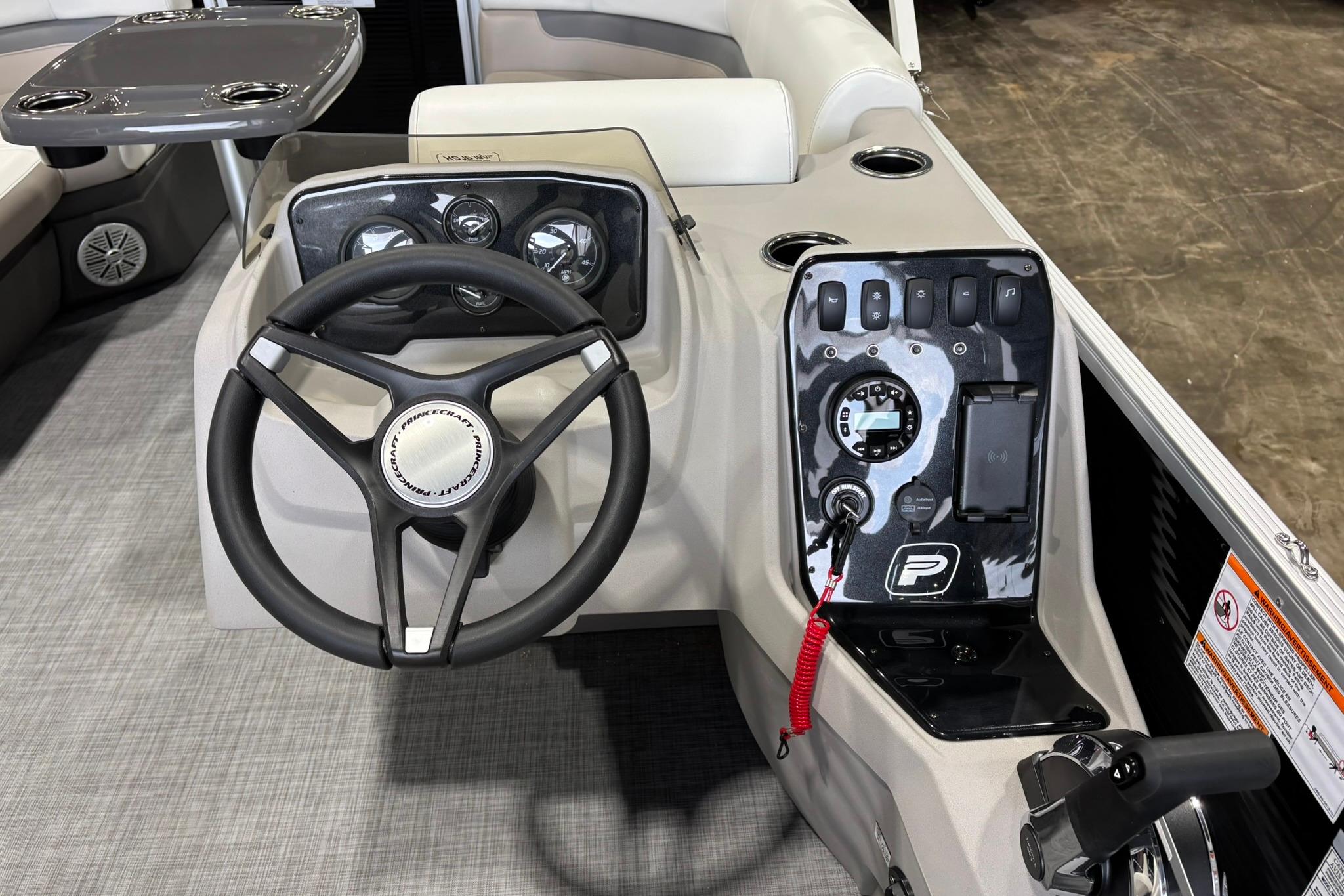 2025 Princecraft Vectra 21 RL boat dashboard with steering wheel and control panel.