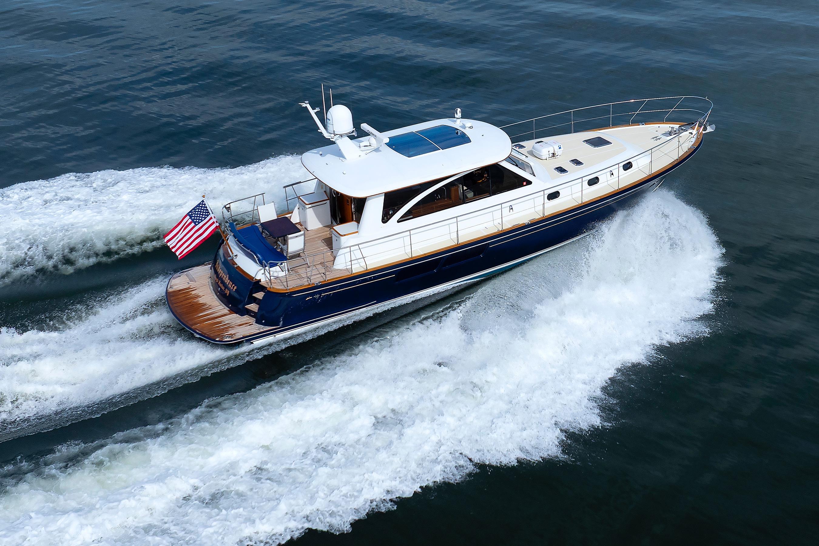 2009 Hunt Yachts 52 Express cruising on open water, displaying American flag.