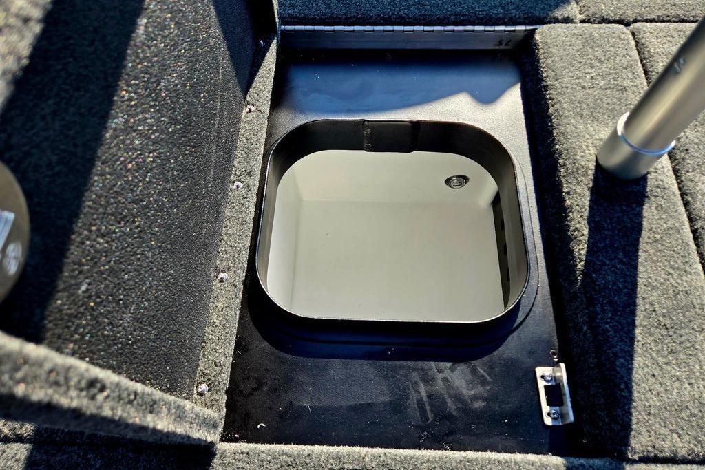 Open storage compartment in 2026 Skeeter ZXE20 boat interior.