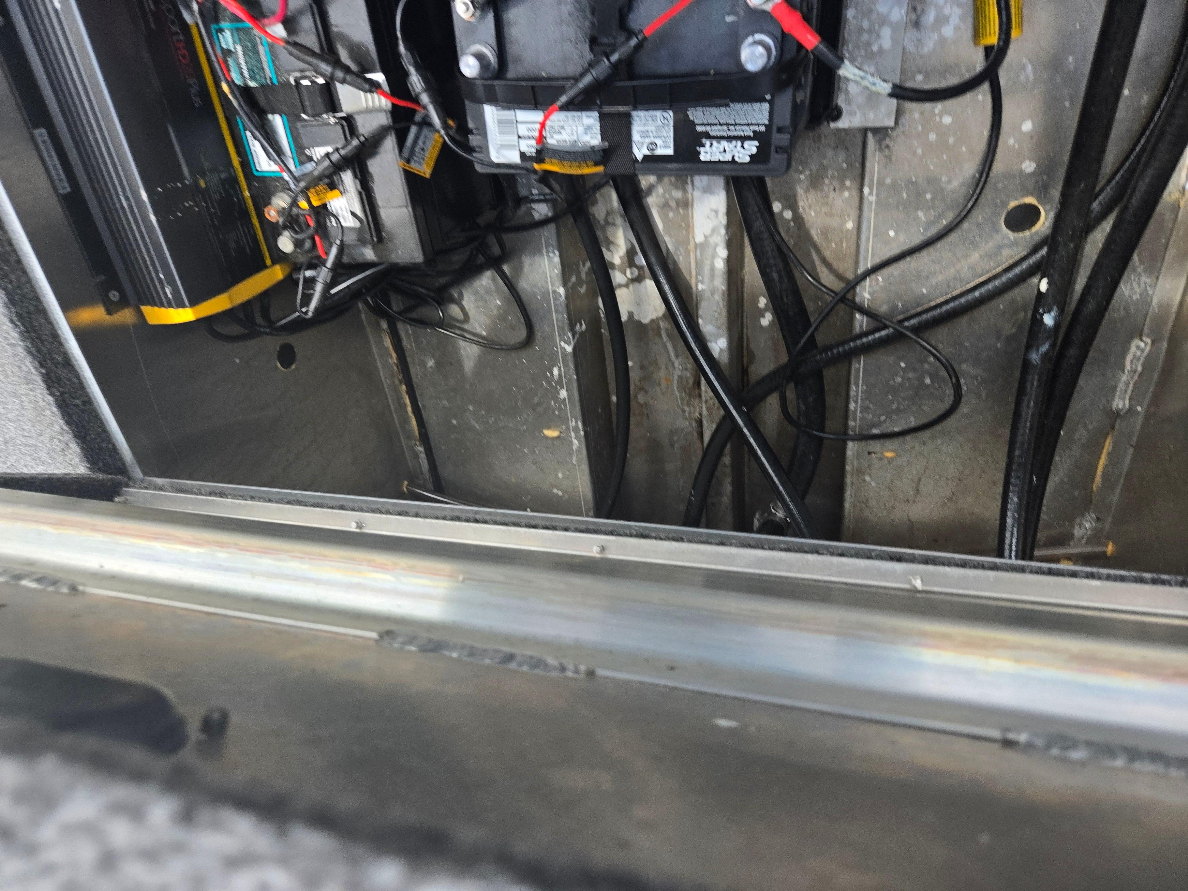 2021 Lowe Stinger 188 boat battery compartment with wiring and connections.