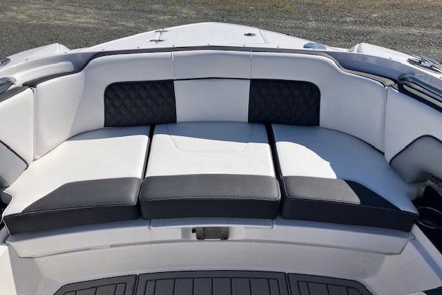 2024 Monterey M-65 boat seating with black and white cushioned upholstery.
