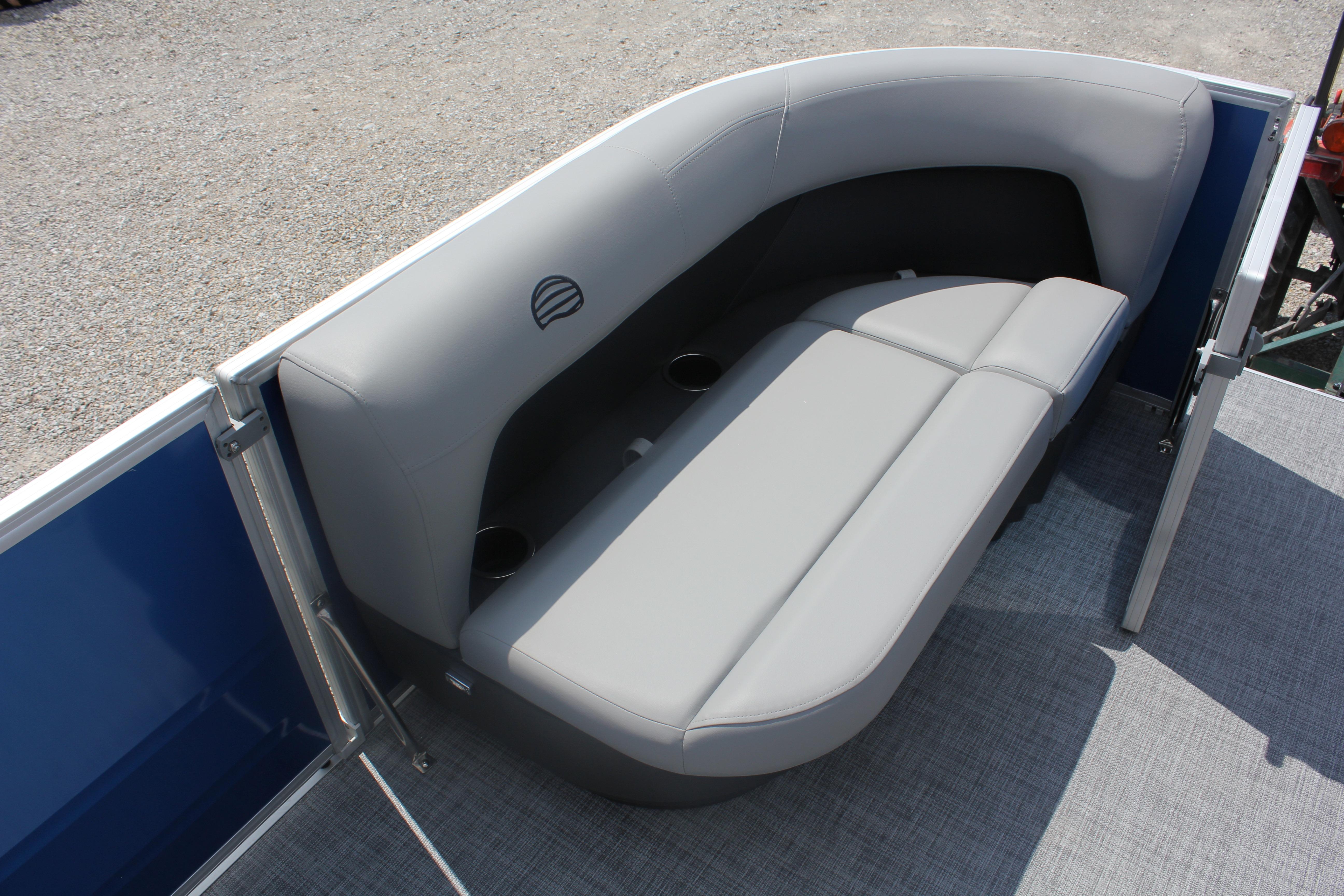 2026 Sun Tracker Party Barge 16 DLX pontoon boat seating area with gray upholstery.