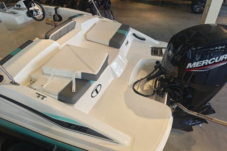2026 Tahoe T16 boat with Mercury outboard motor, featuring sleek seating and modern design.