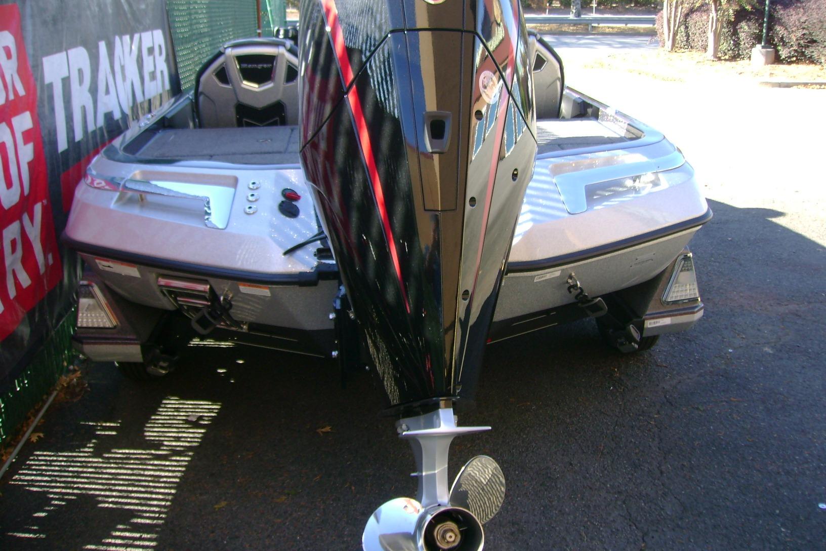 2025 Ranger Z520 boat with powerful outboard motor, parked outdoors.