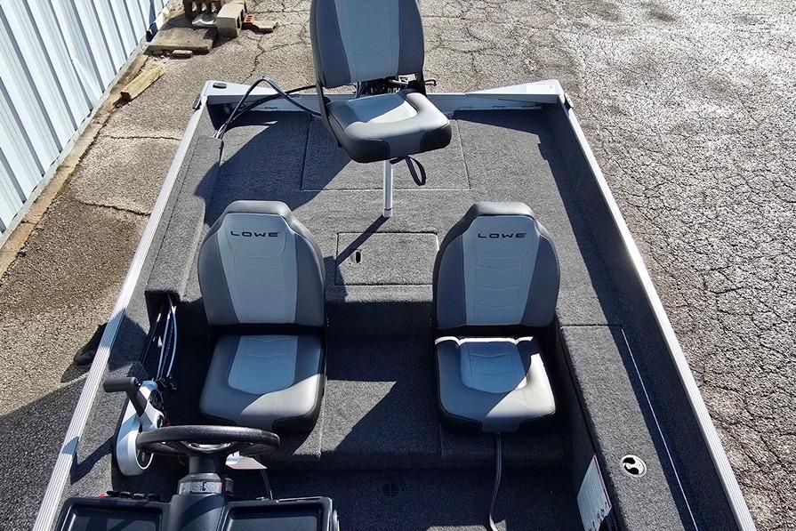 2026 Lowe Skorpion 17 boat interior with three seats and steering console.