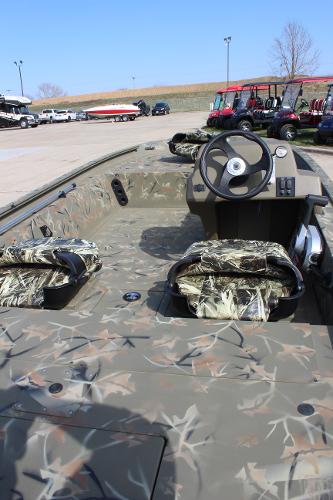 2024 Tracker Grizzly 1754 SC camo boat interior with steering console.