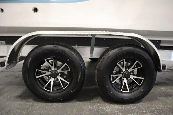 2025 Sea Fox 228 Traveler trailer wheels with sleek black and silver rims.