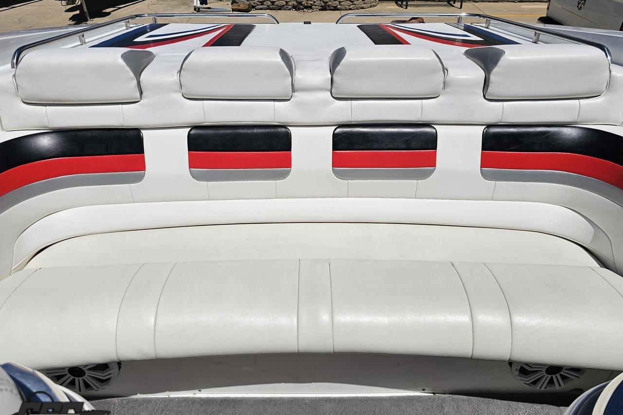 2005 Formula 271 FASTech boat interior with white, black, and red seating.
