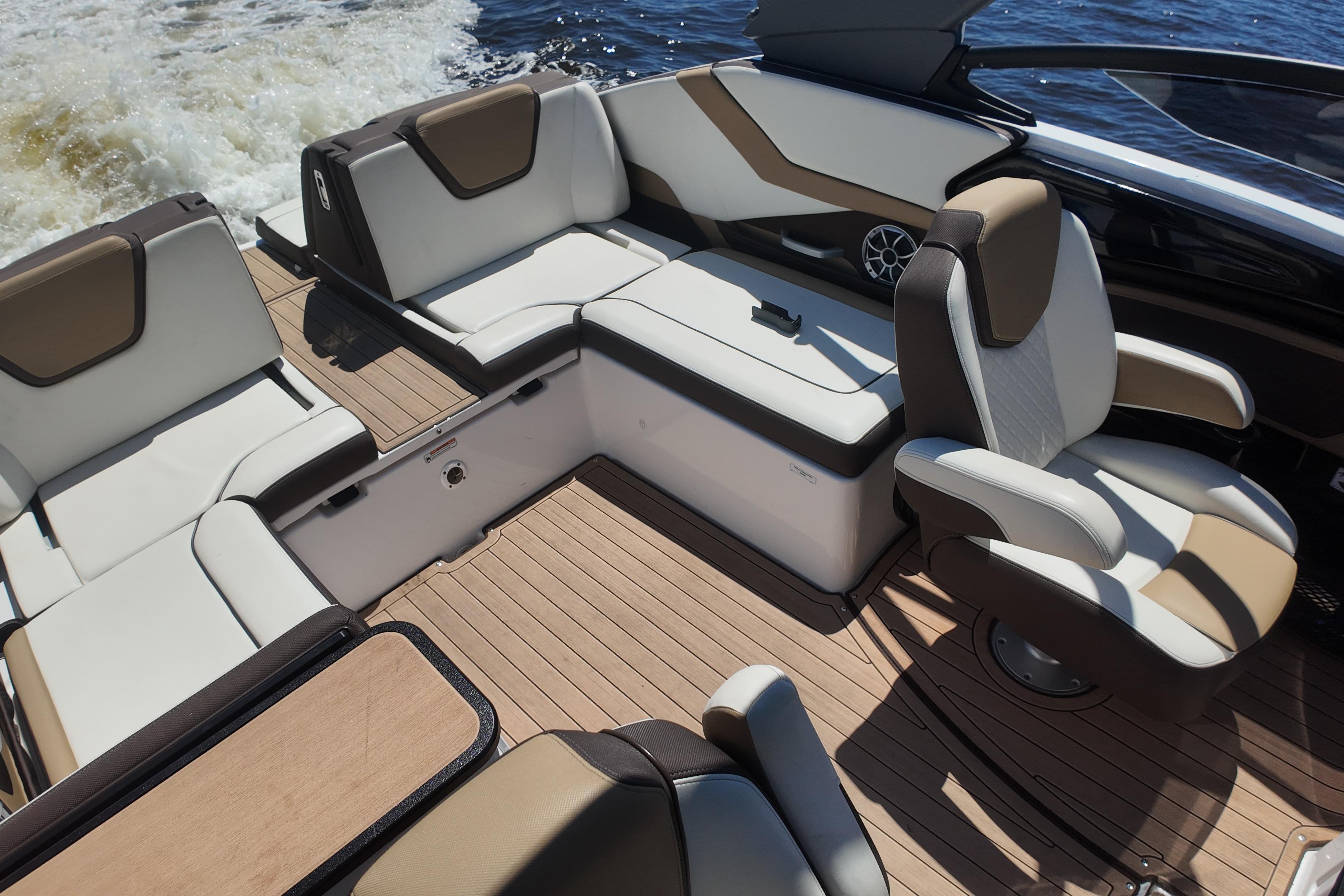 2021 Yamaha Boats 252S interior with luxurious seating and sleek design on the water.