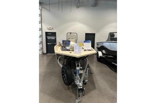 2026 G3 Bay 17 boat on display in showroom with informational signs.