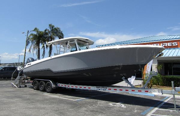 2024 Wellcraft 352 Fisherman boat on a trailer in a parking lot.
