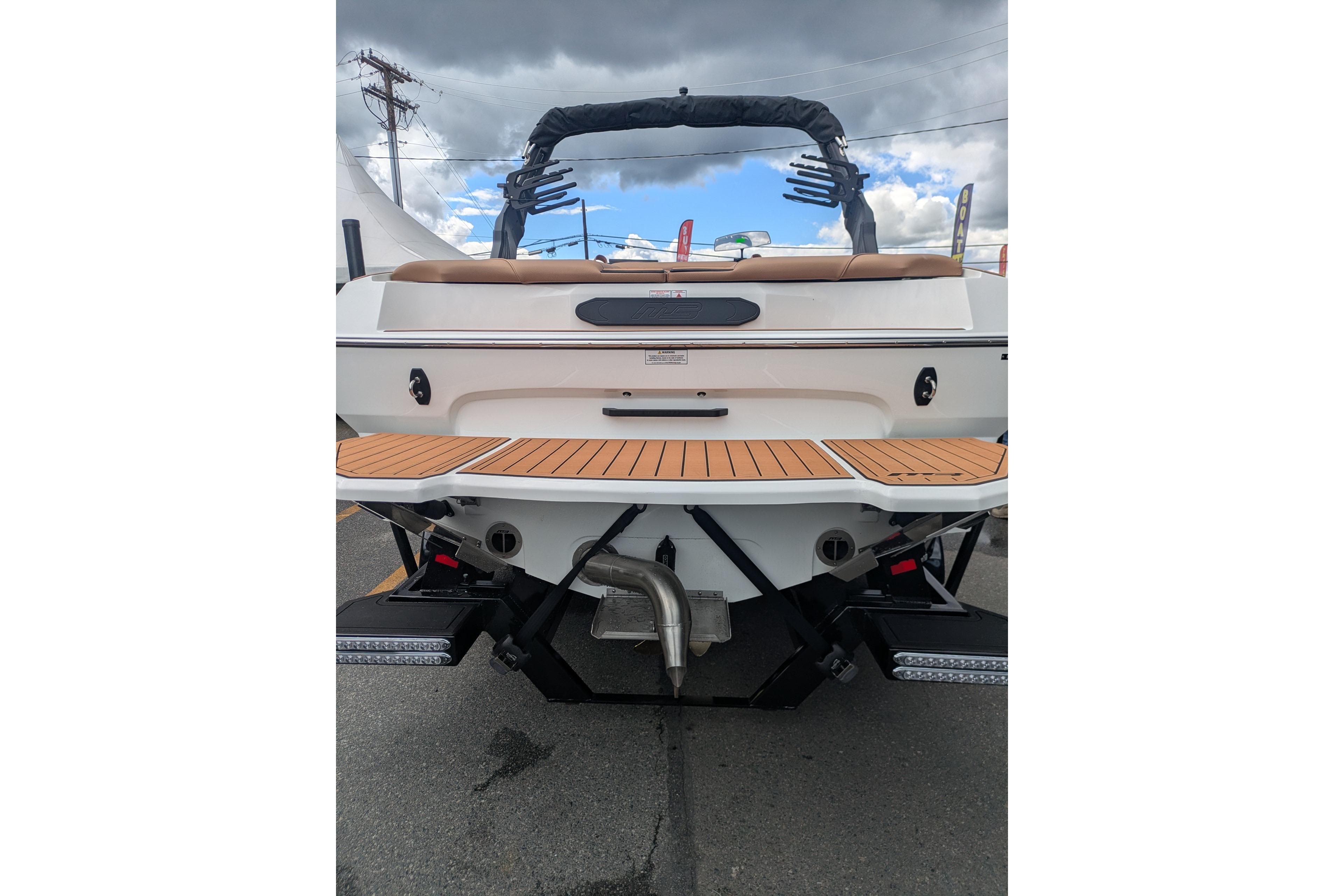 2026 MB B52-23 Classic LIMITED boat rear view with teak deck and wakeboard tower.