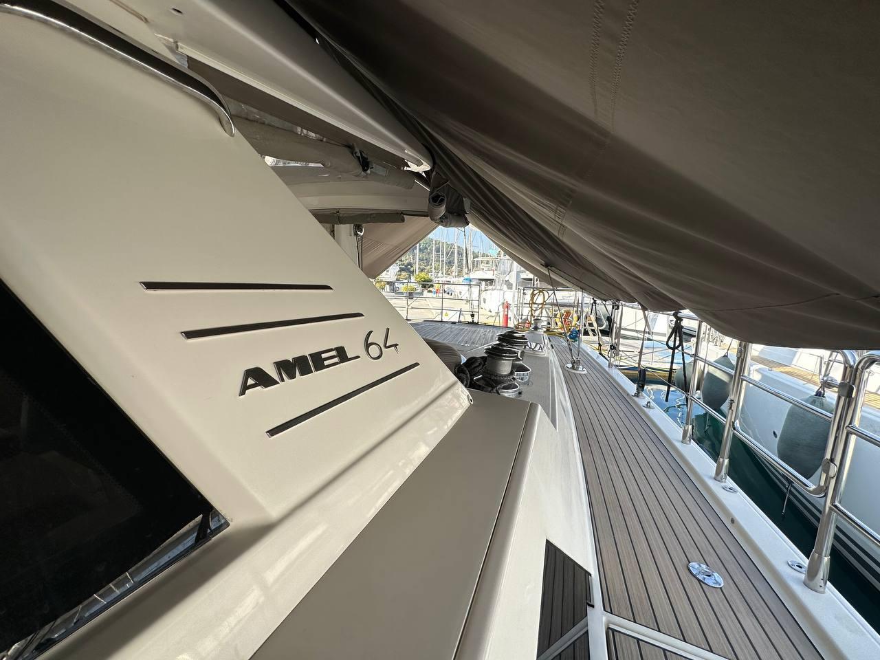 Luxury yacht Amel 64, 2015 model, featuring sleek deck design and modern amenities.