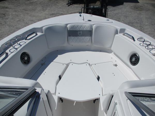 2025 Sea Fox 228 Traveler boat interior with seating and cup holders.