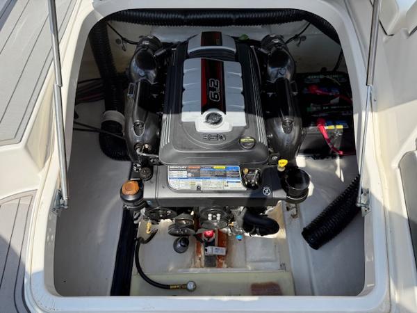 Engine compartment of 2023 Chaparral 267 SSX boat, showcasing powerful engine components.
