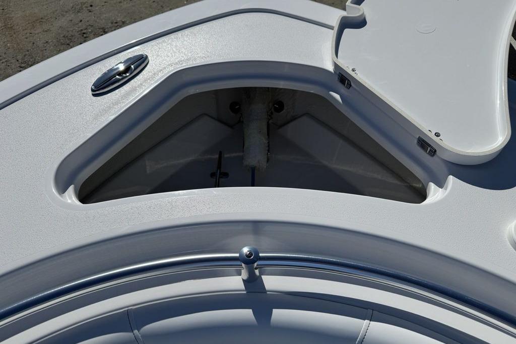 Open storage compartment on 2026 Sportsman Open 232 Center Console boat.