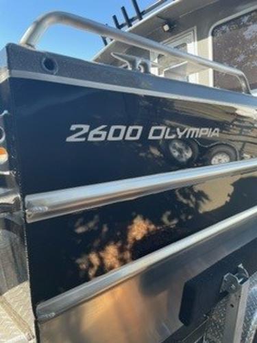 2025 Spartan 2600 Olympia boat, sleek black exterior with chrome details.