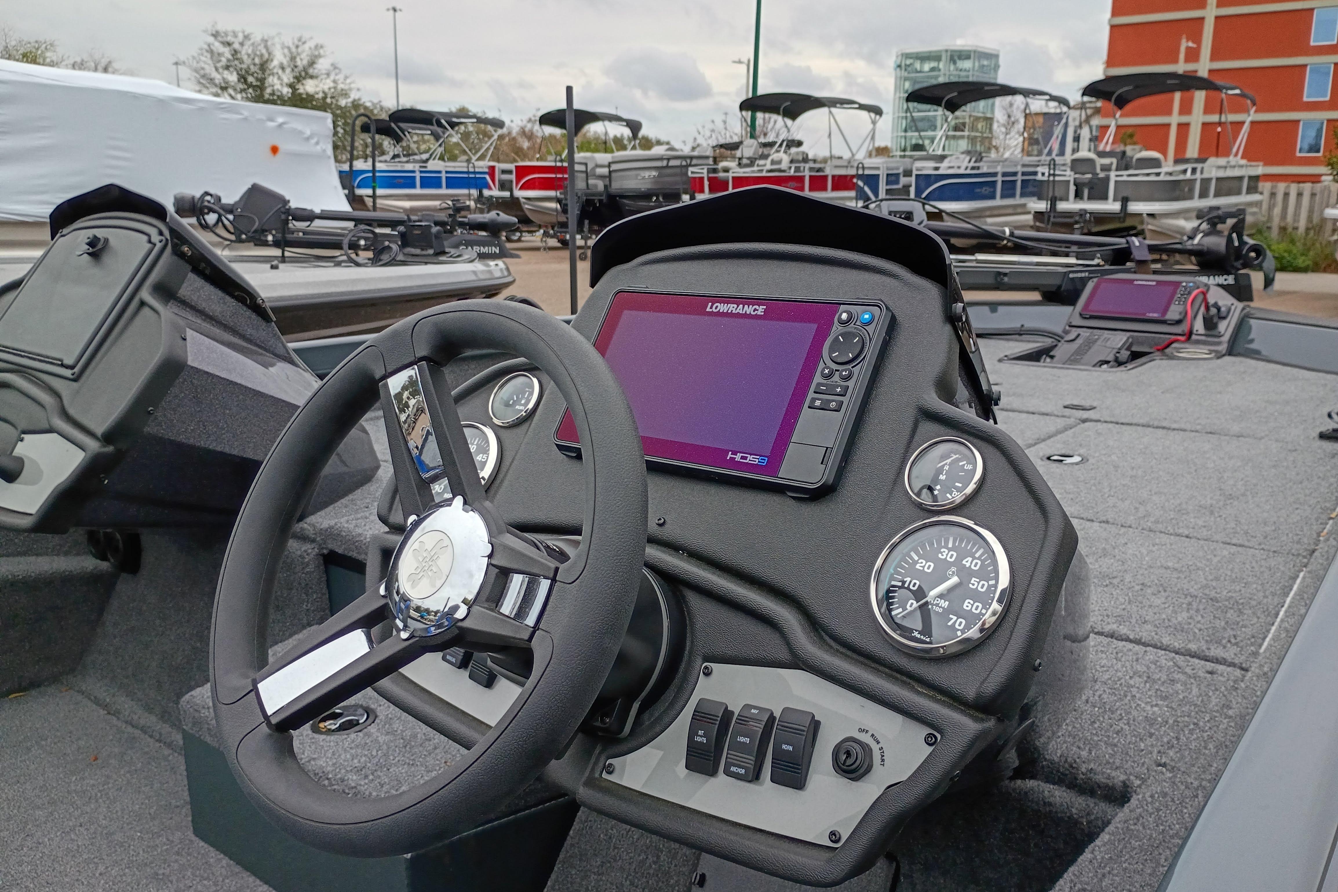 2026 Ranger RT198P boat dashboard with steering wheel and navigation system.