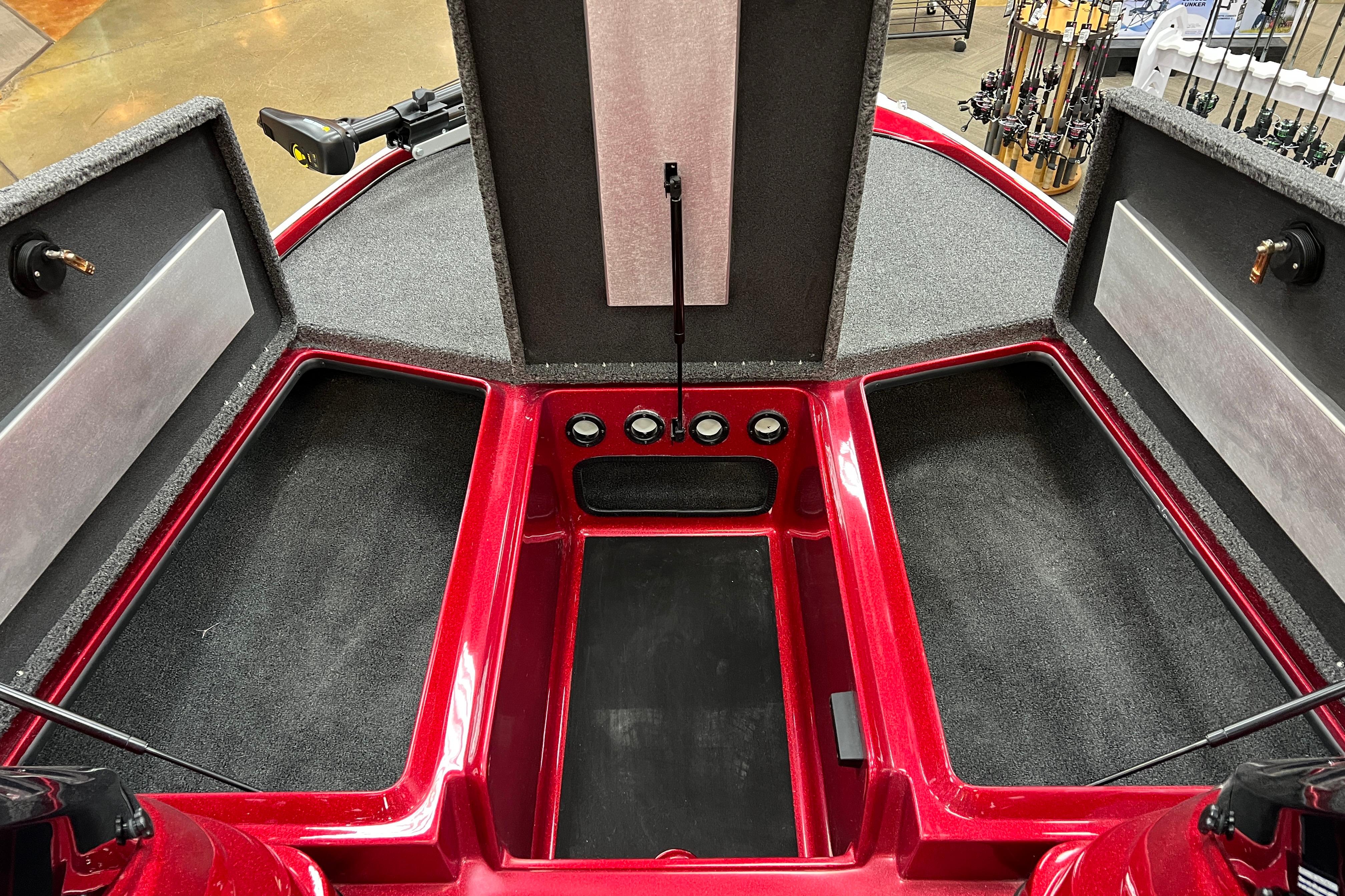 Red Nitro Z17 boat interior with open storage compartments, showcasing modern design and functionality.