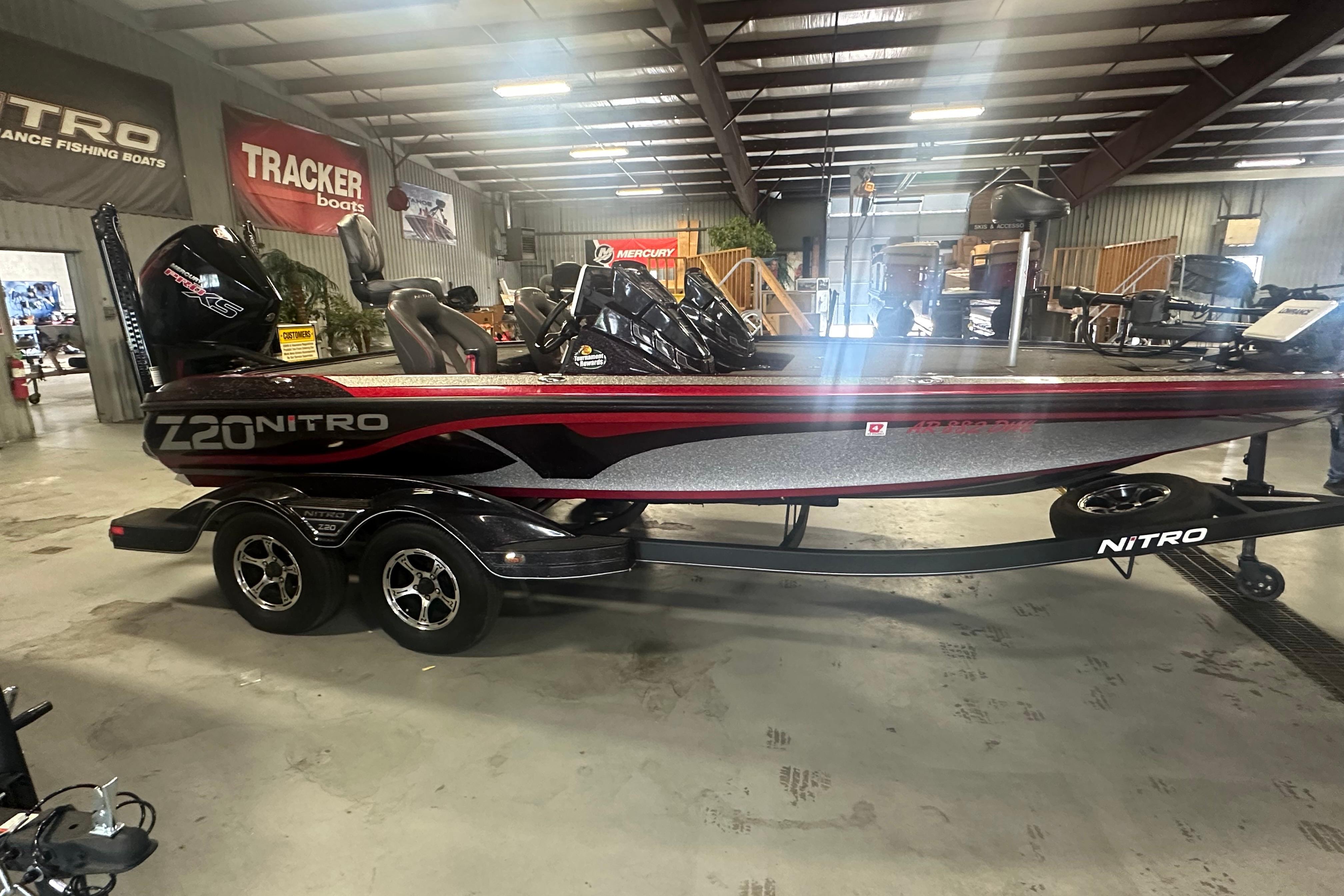 2022 Nitro Z20 Pro boat in showroom, featuring sleek design and dual-axle trailer.