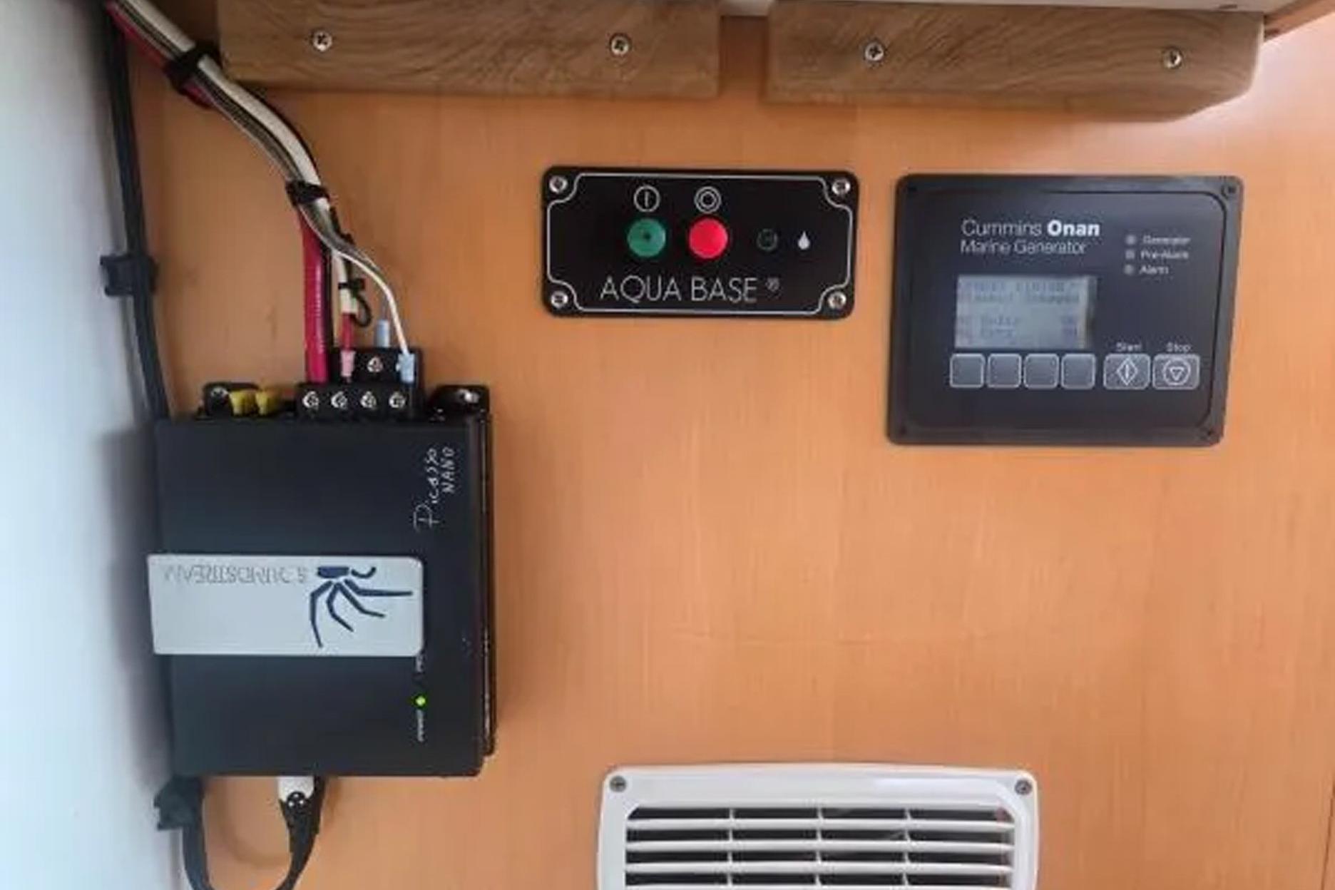 Control panel of a 2008 Fountaine Pajot Salina 48 with Cummins Onan marine generator.