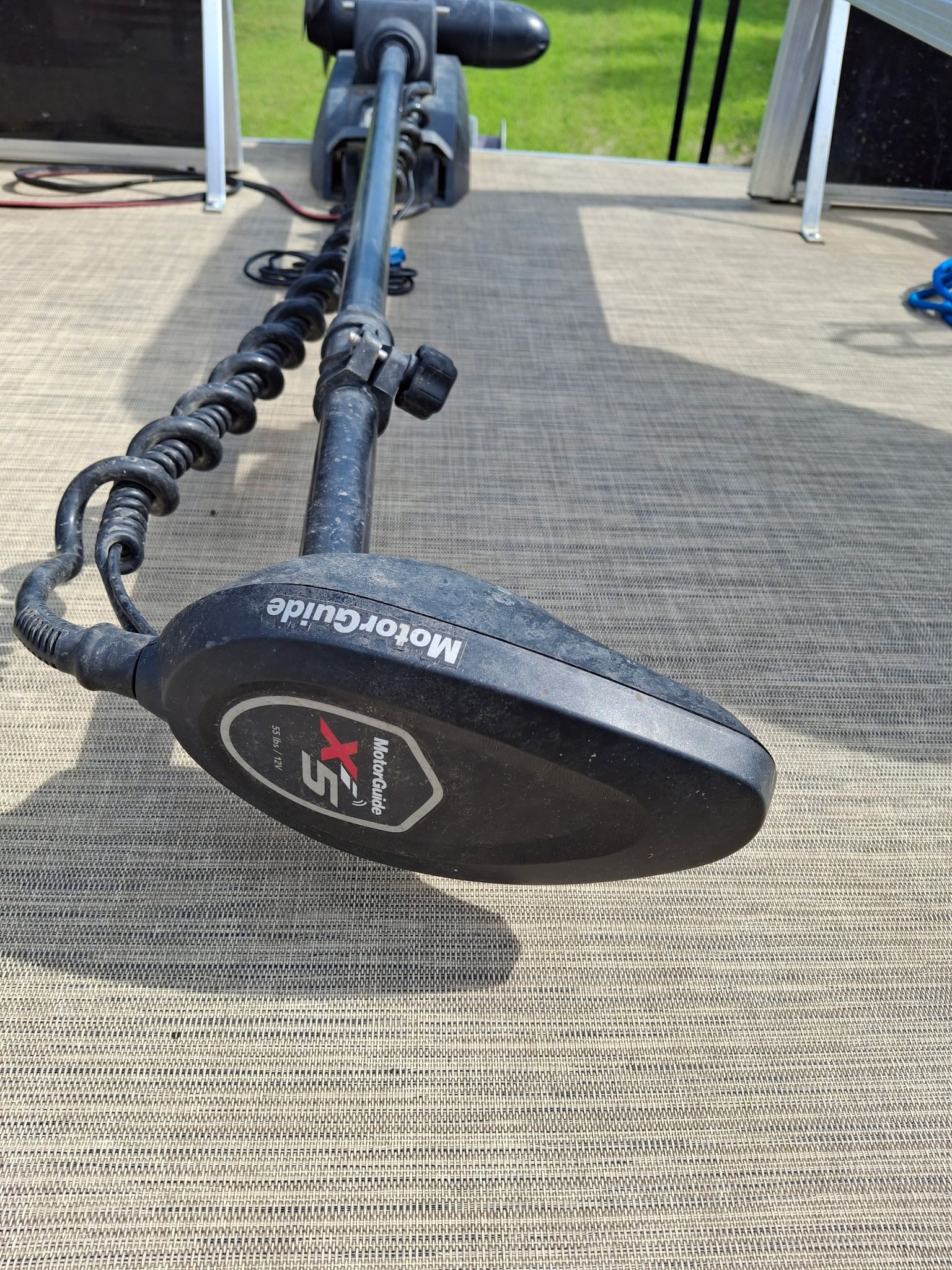 Close-up of a MotorGuide X5 trolling motor on a boat.