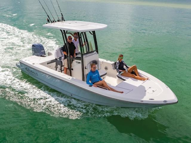 2024 Robalo 226 Cayman boat cruising with passengers on clear water.