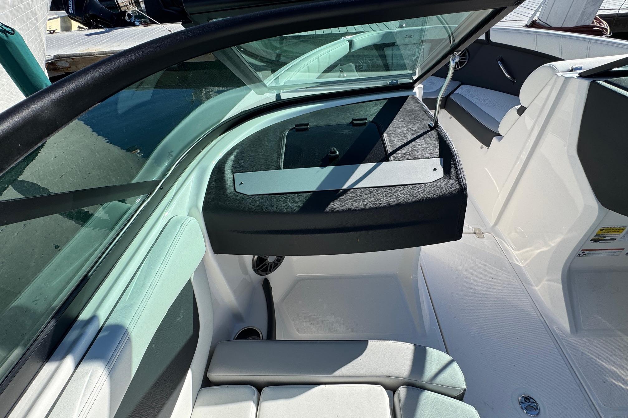 Interior view of 2026 Regal 21 OBX boat, featuring seating and dashboard.