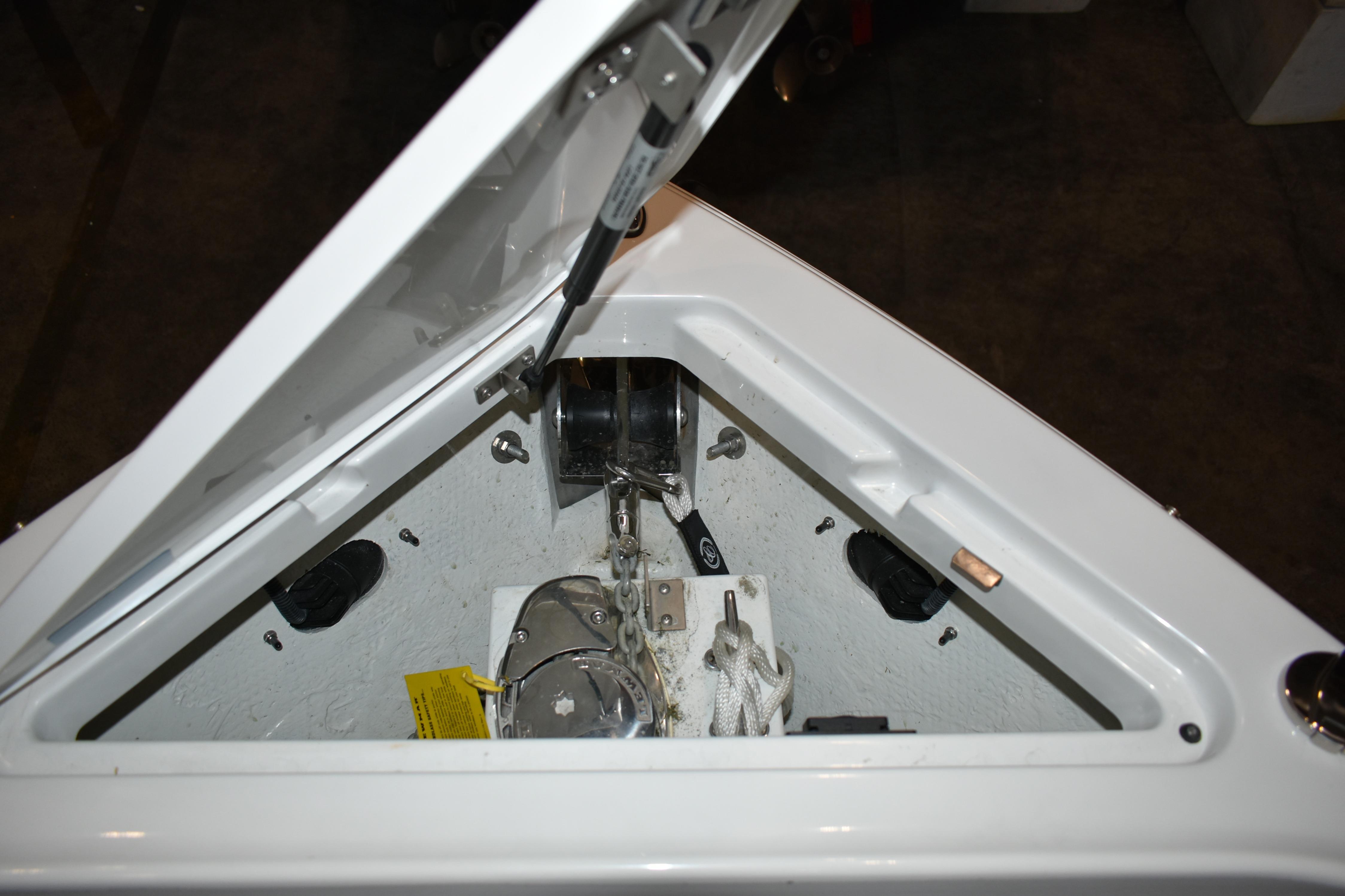 Anchor compartment of 2023 Cobalt R8 boat, featuring winch and rope storage.