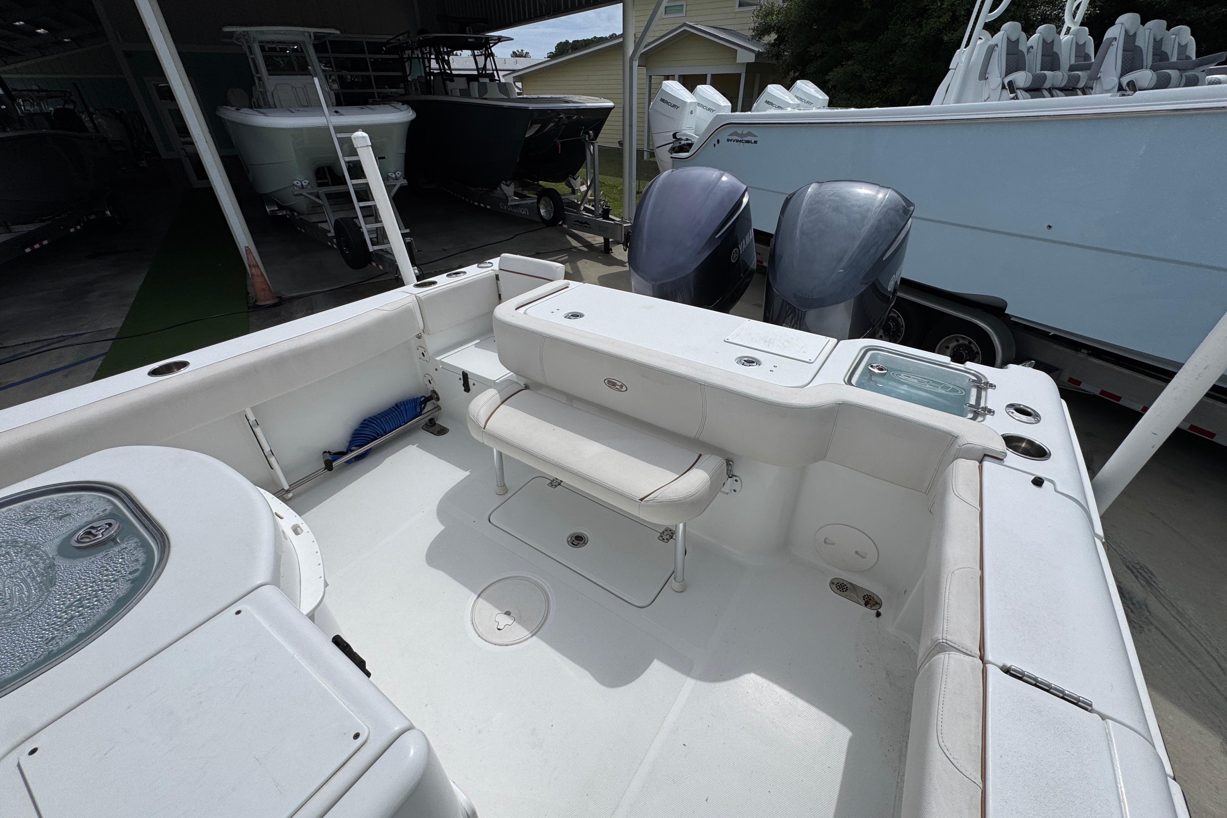 2020 Sea Hunt Gamefish 30 boat with forward seating and twin engines.
