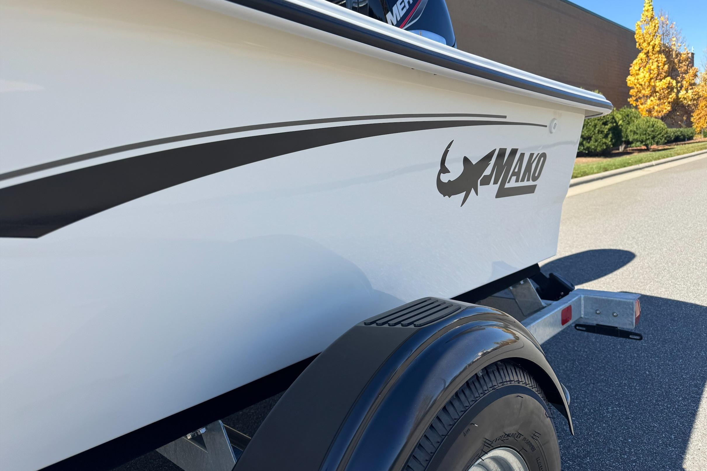 2026 Mako Pro Skiff 17 CC boat on trailer, side view with logo.