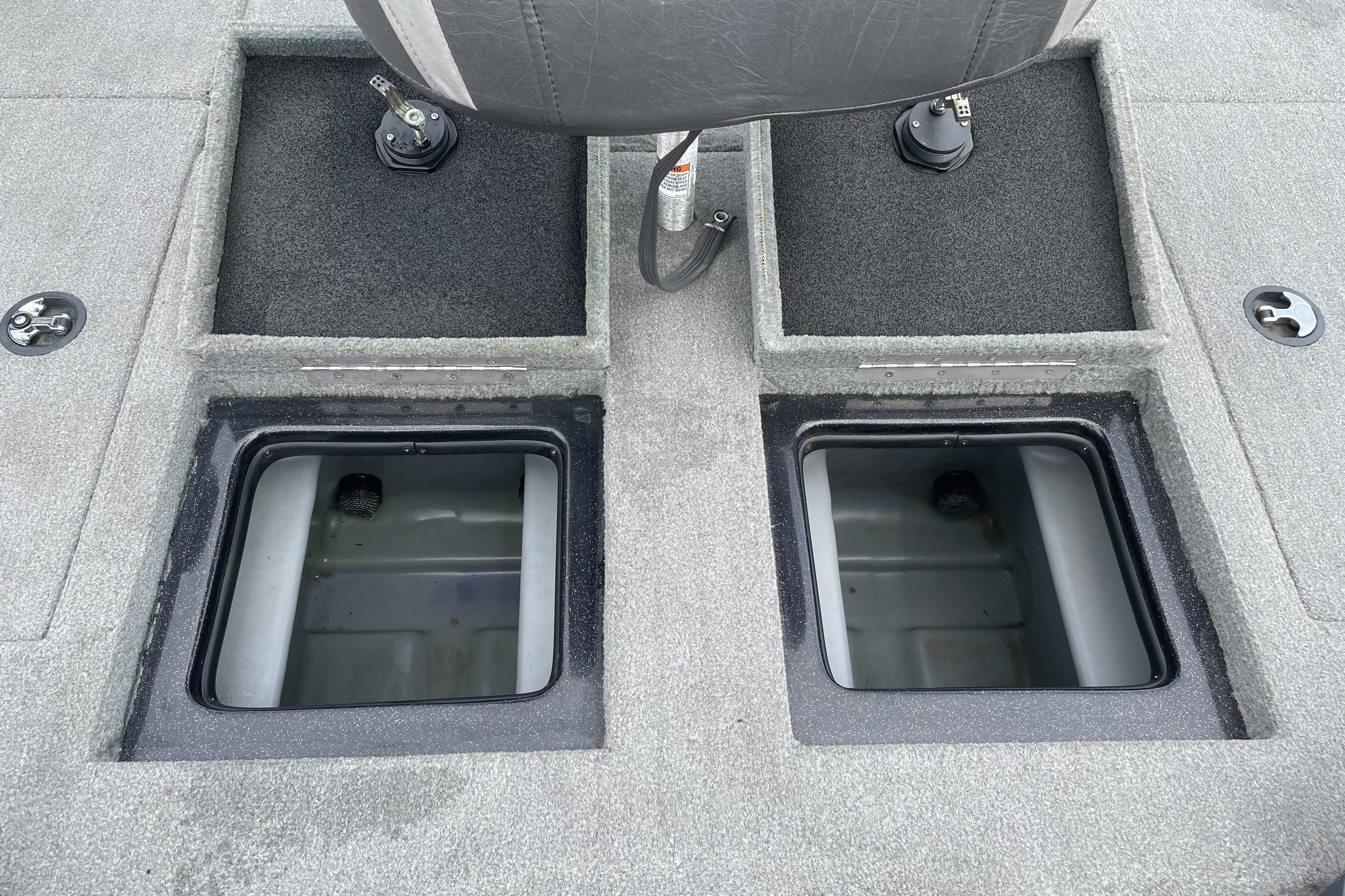 2013 Nitro Z-8 boat storage compartments with gray carpet and seat detail.