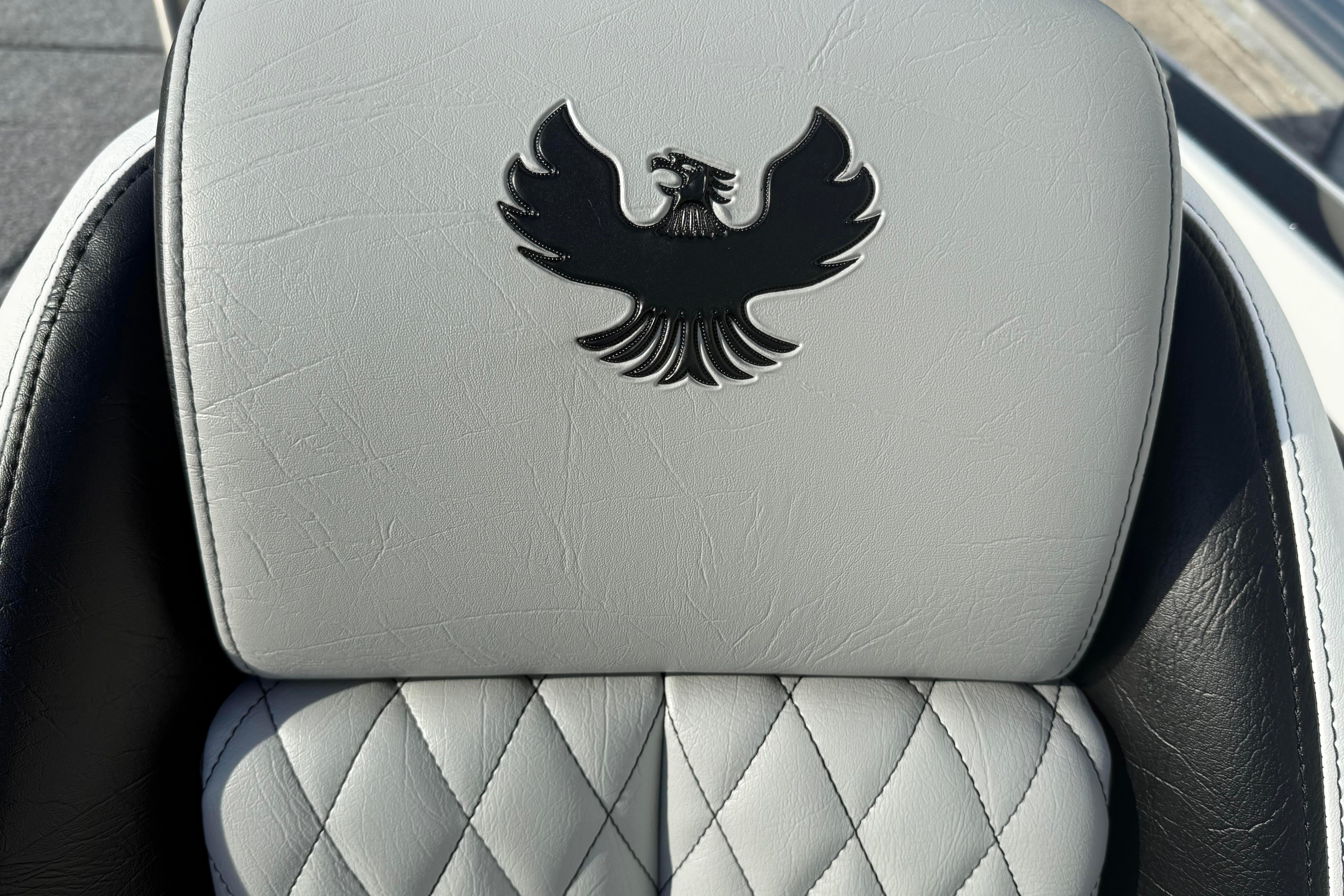 Luxurious Phoenix 721 ZXL 2027 seat with diamond stitching and embossed eagle logo.