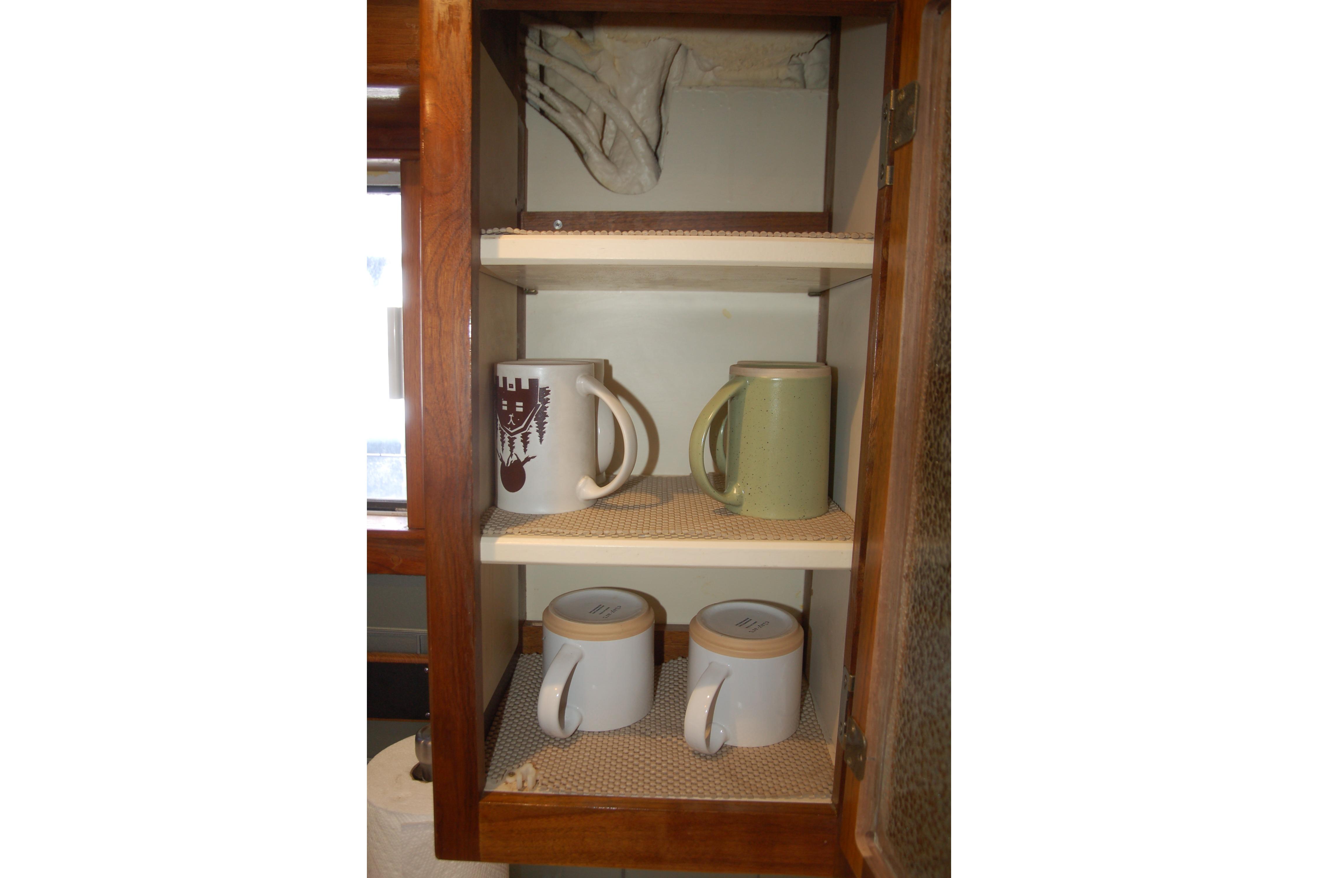 Wooden cabinet with mugs and cups on shelves, Custom Sprague model, 2006.