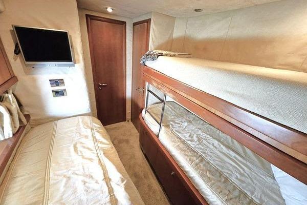 Interior cabin of 2005 Sunseeker Manhattan 66 yacht with bunk beds and TV.