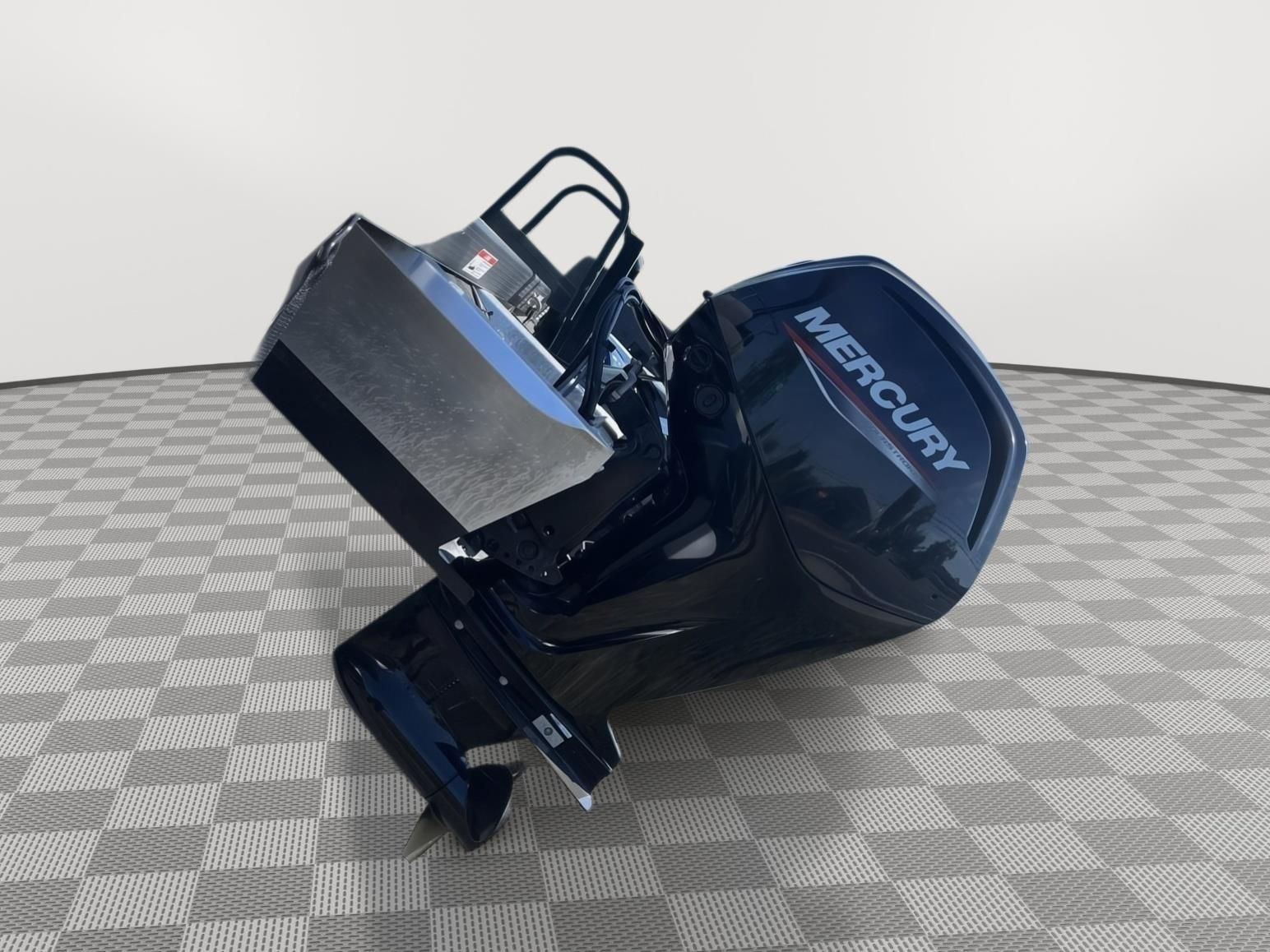 A Mercury outboard motor on a checkered floor. The motor is black and shiny.