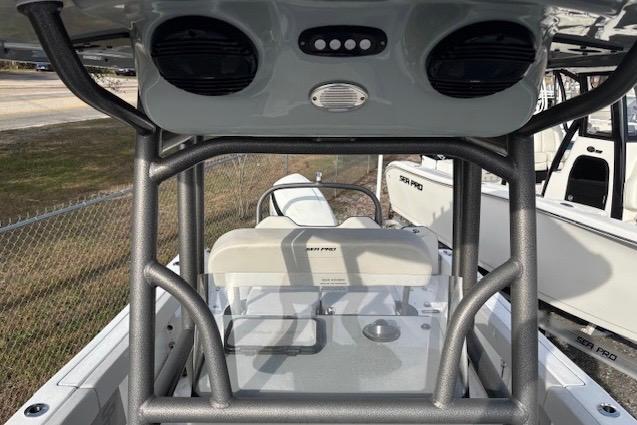 2025 Sea Pro 225FLX Sandbar boat interior with seating and console view.