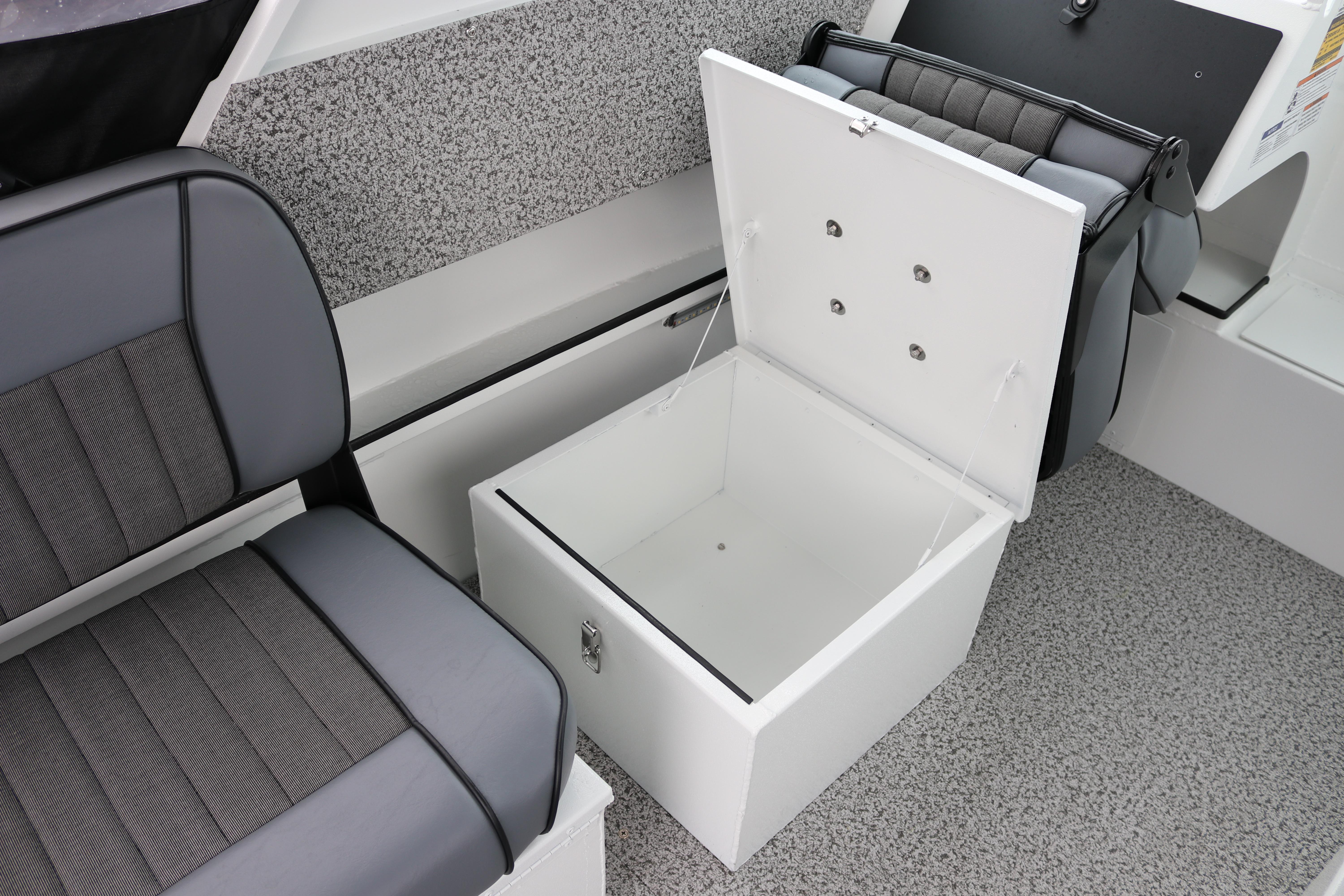 2026 Alumaweld Stryker 202 boat interior with open storage compartment and cushioned seating.